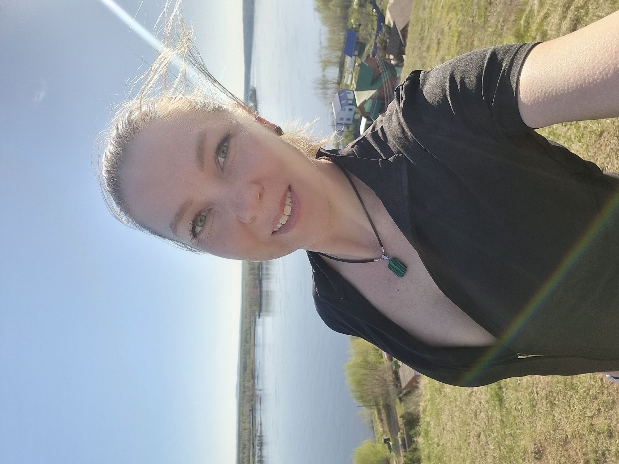 Woman photographs scenic river overlook session in Ольховка, Russia