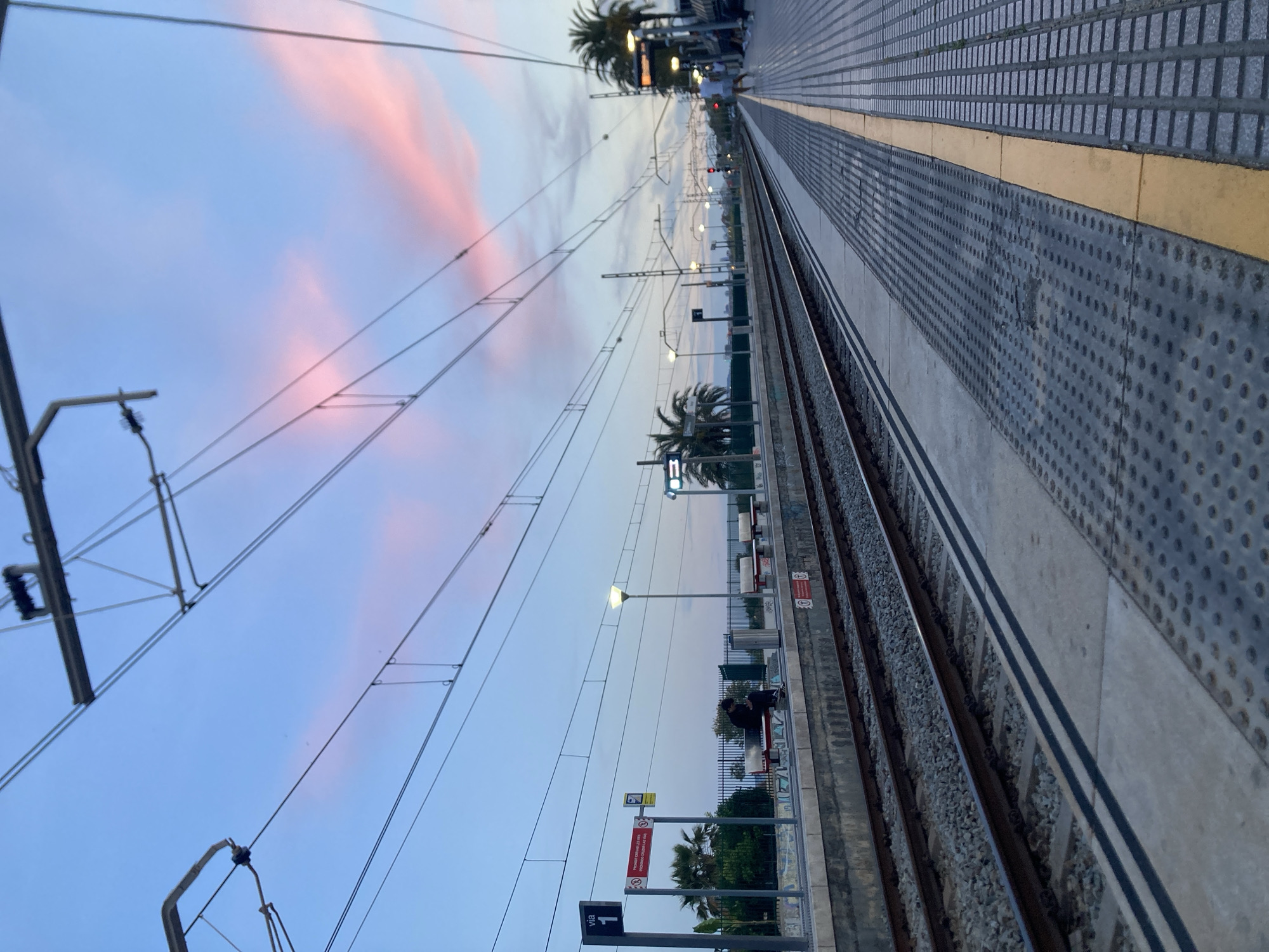 Train platform observed at dusk in Montgat, Spain