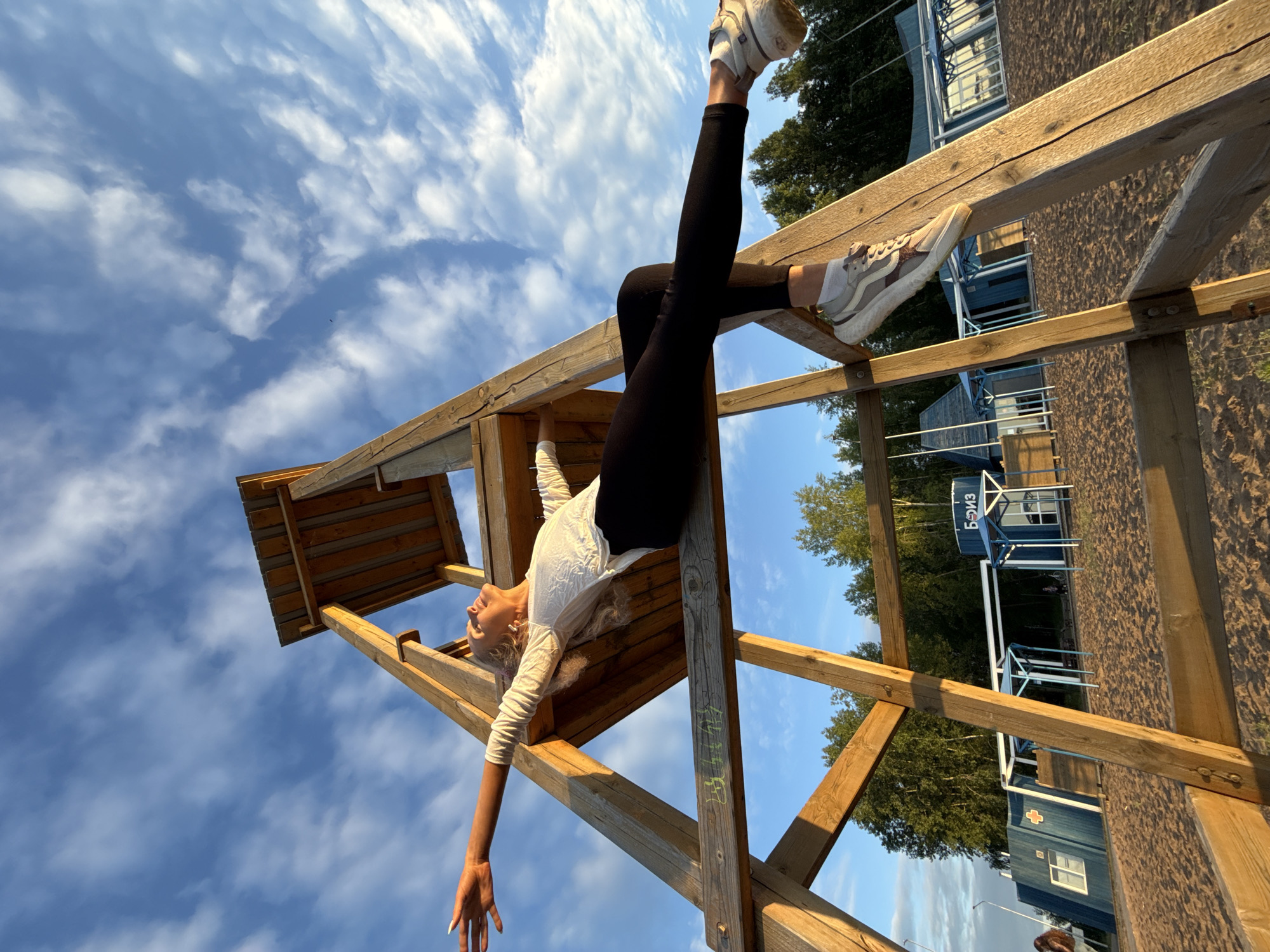 Woman photographed at sunset beach observation tower in Chaikovsky