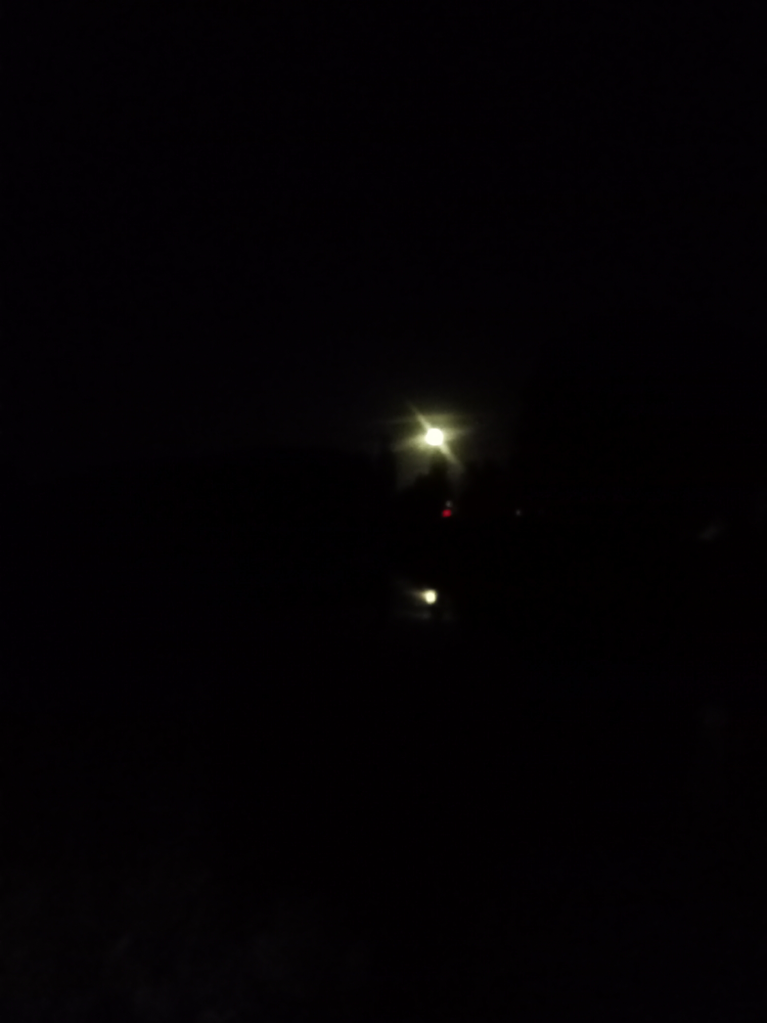 Night streets, streetlamps, and a spider web close-up