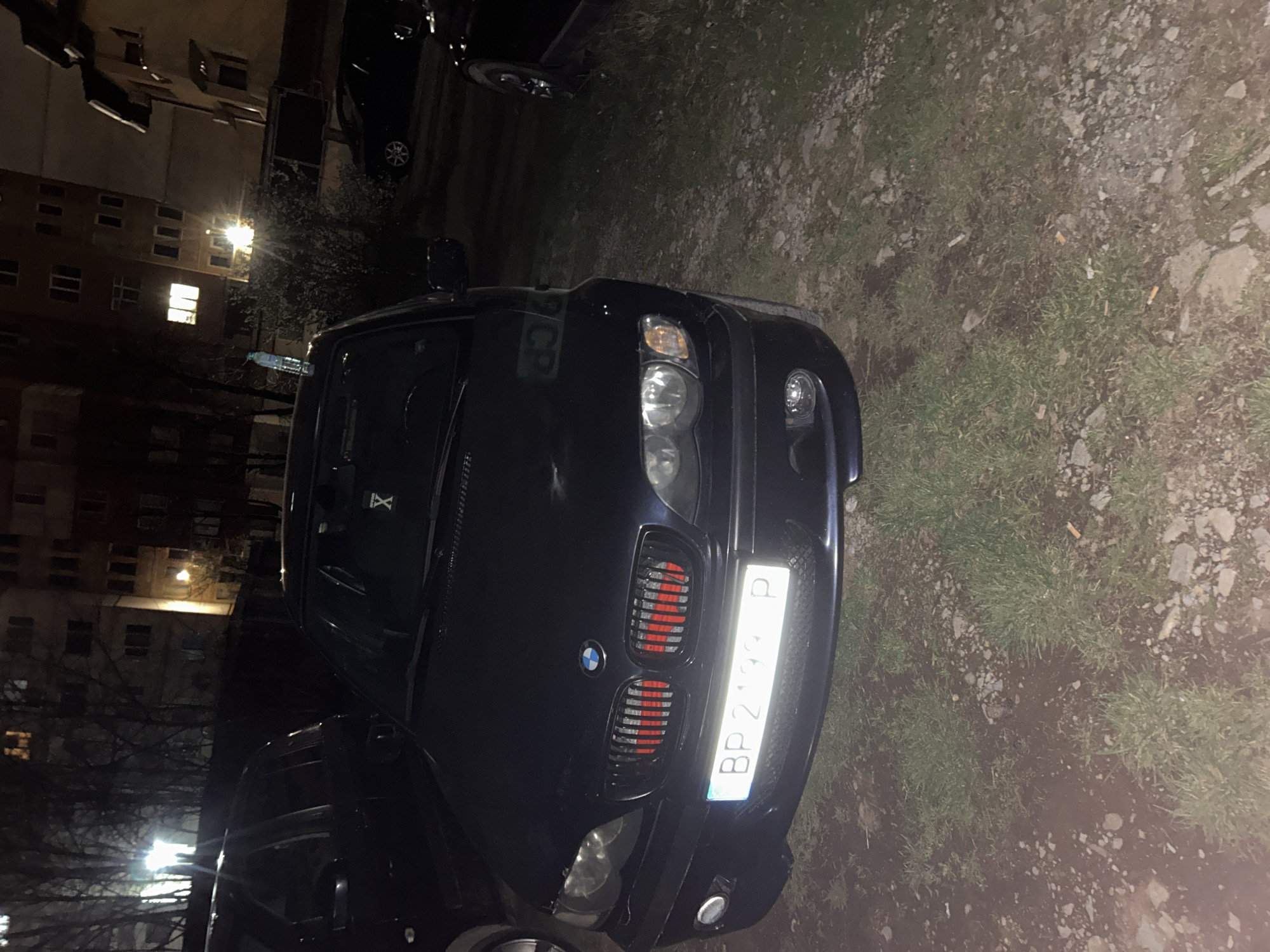 BMW parked on grass and gravel in Vratsa