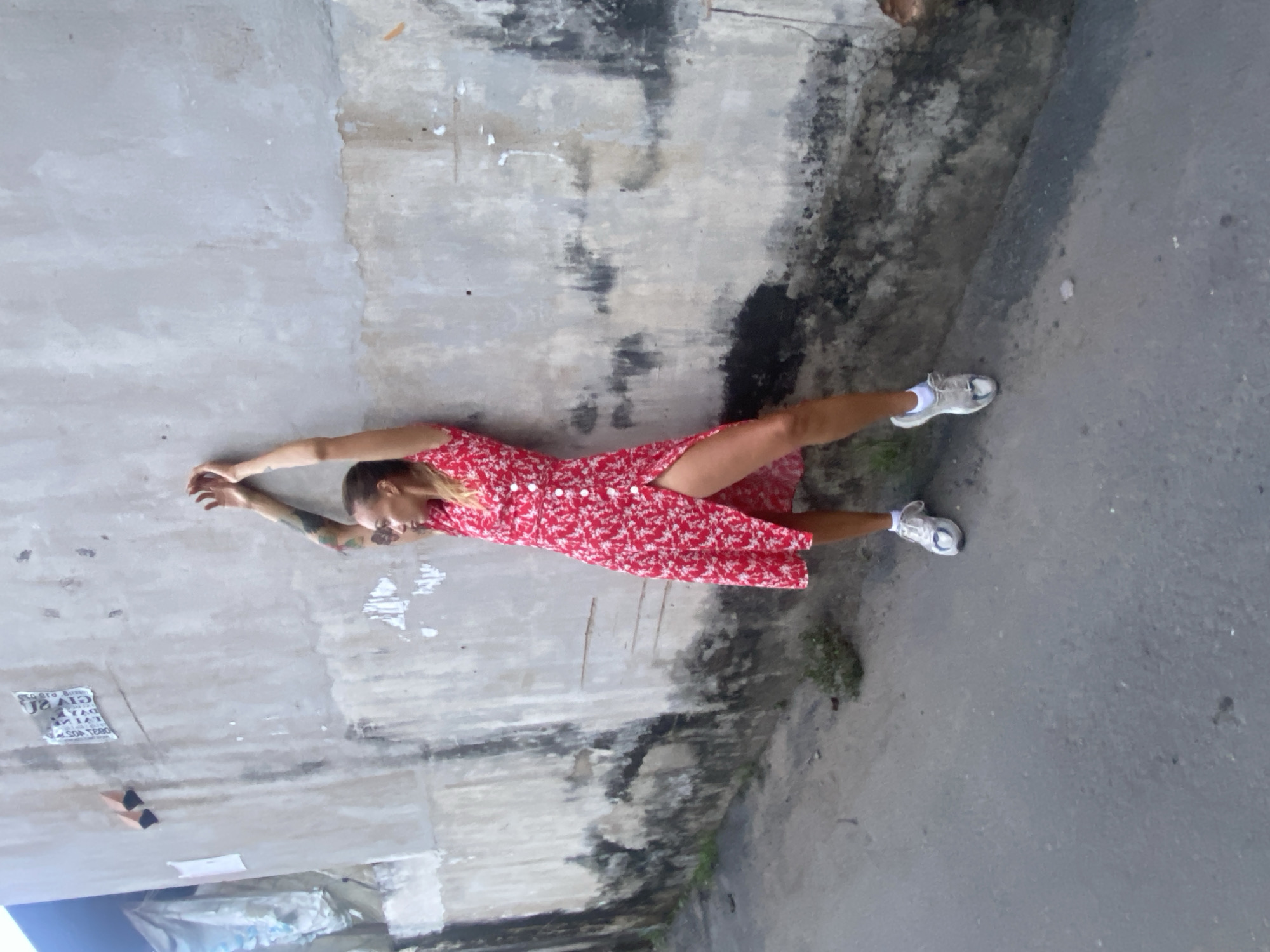 Woman in red dress rests, jogs through Đồng Nai streets
