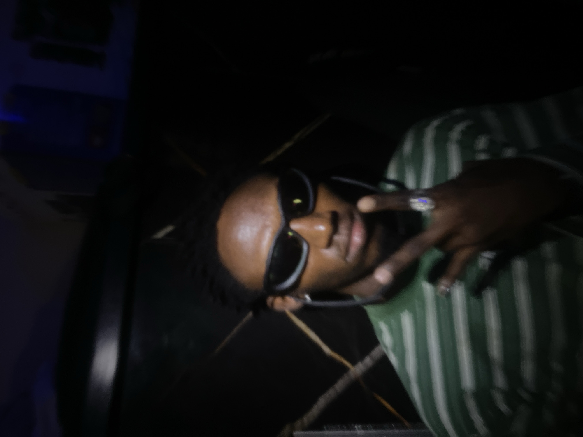 Person documents themselves with jewelry and gestures in Lokoja