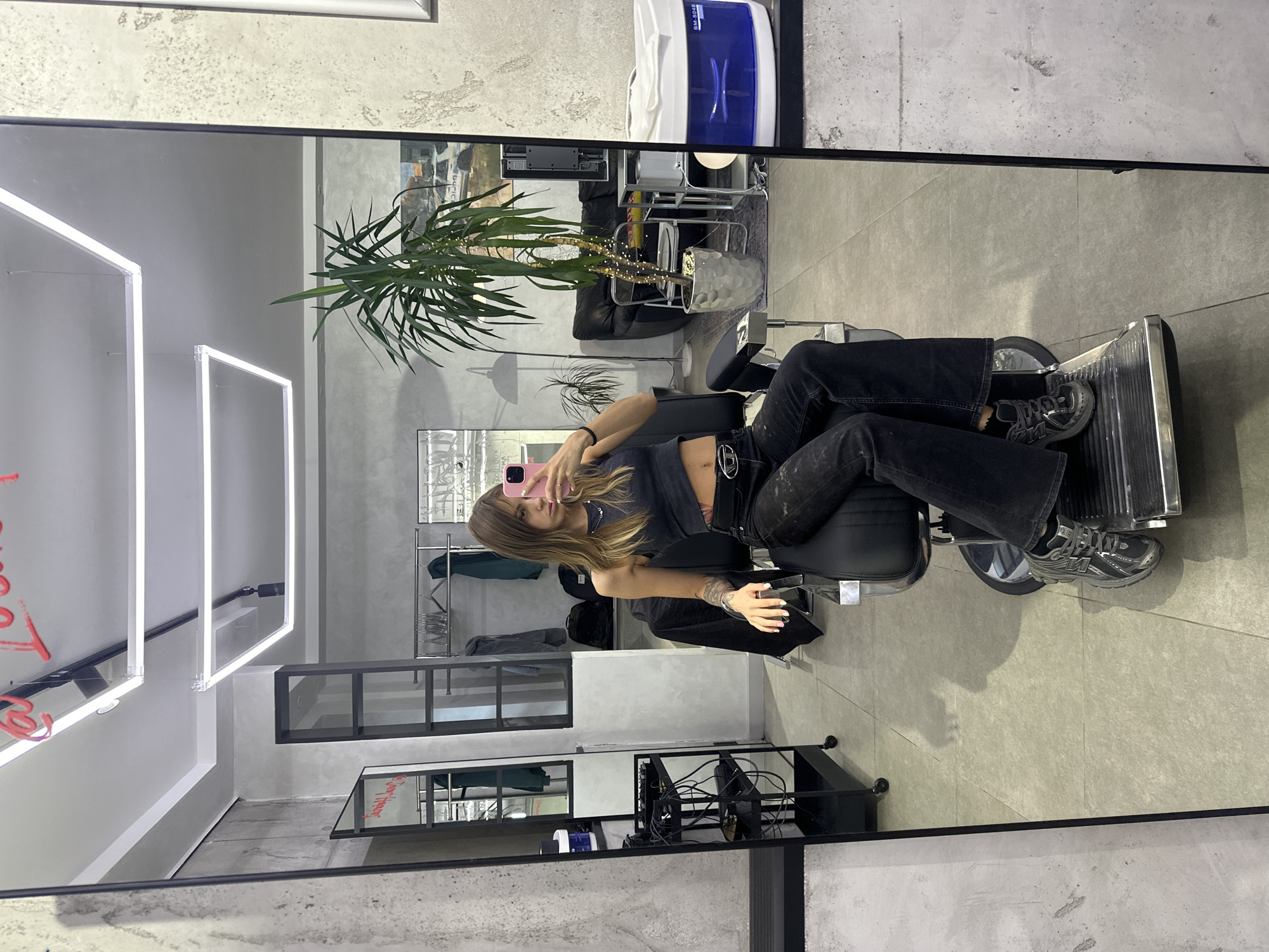 Barber chair mirror selfie at a Moscow salon