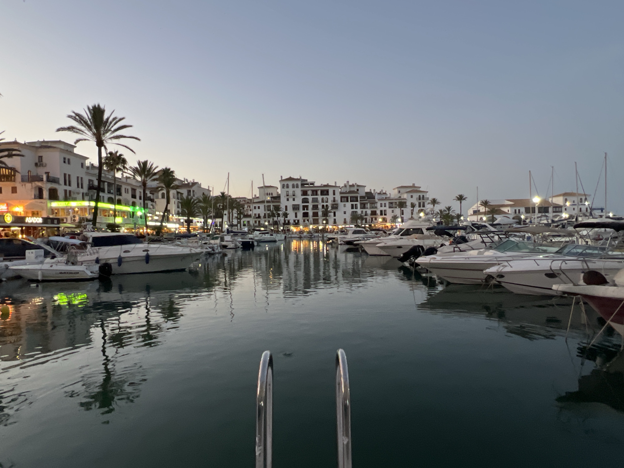 Dusk settles over Castillo De La Duquesa's busy marina