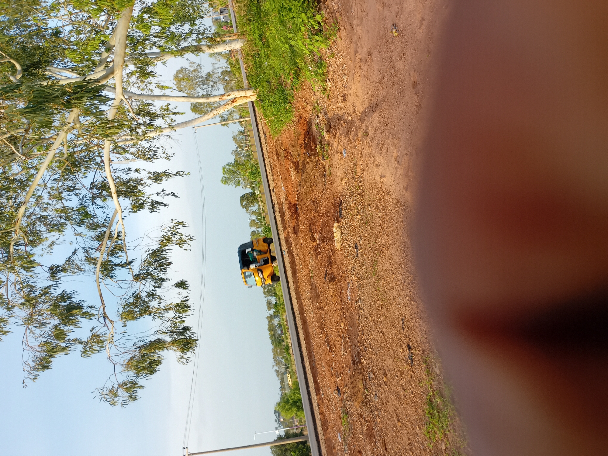 Rural Nigerian morning: rickshaws, footprints, everyday objects documented