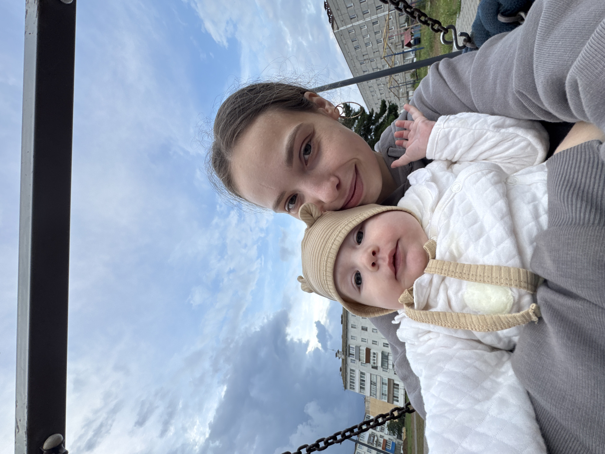 Playground swing session with a baby in Noviy, Russia