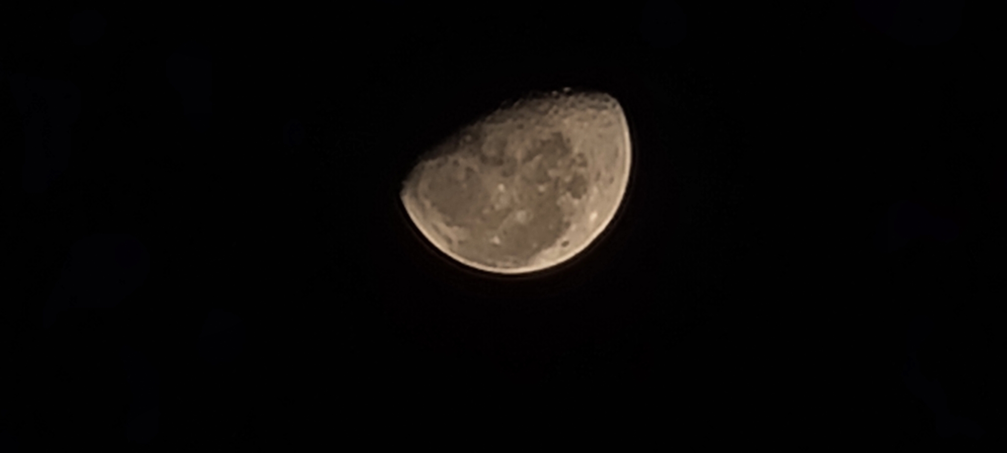 Waning gibbous moon photographed over Tashkent night sky