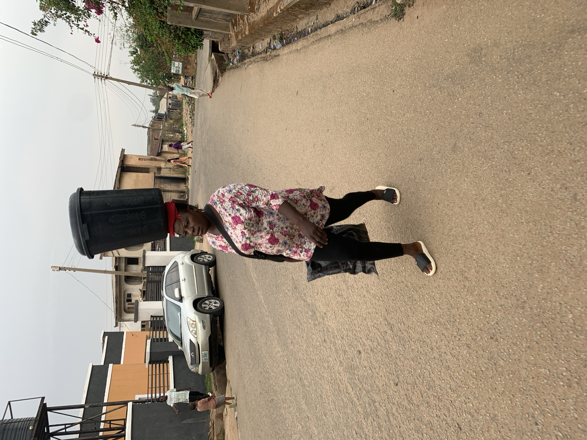 Daily life unfolds on Jos streets during afternoon hours