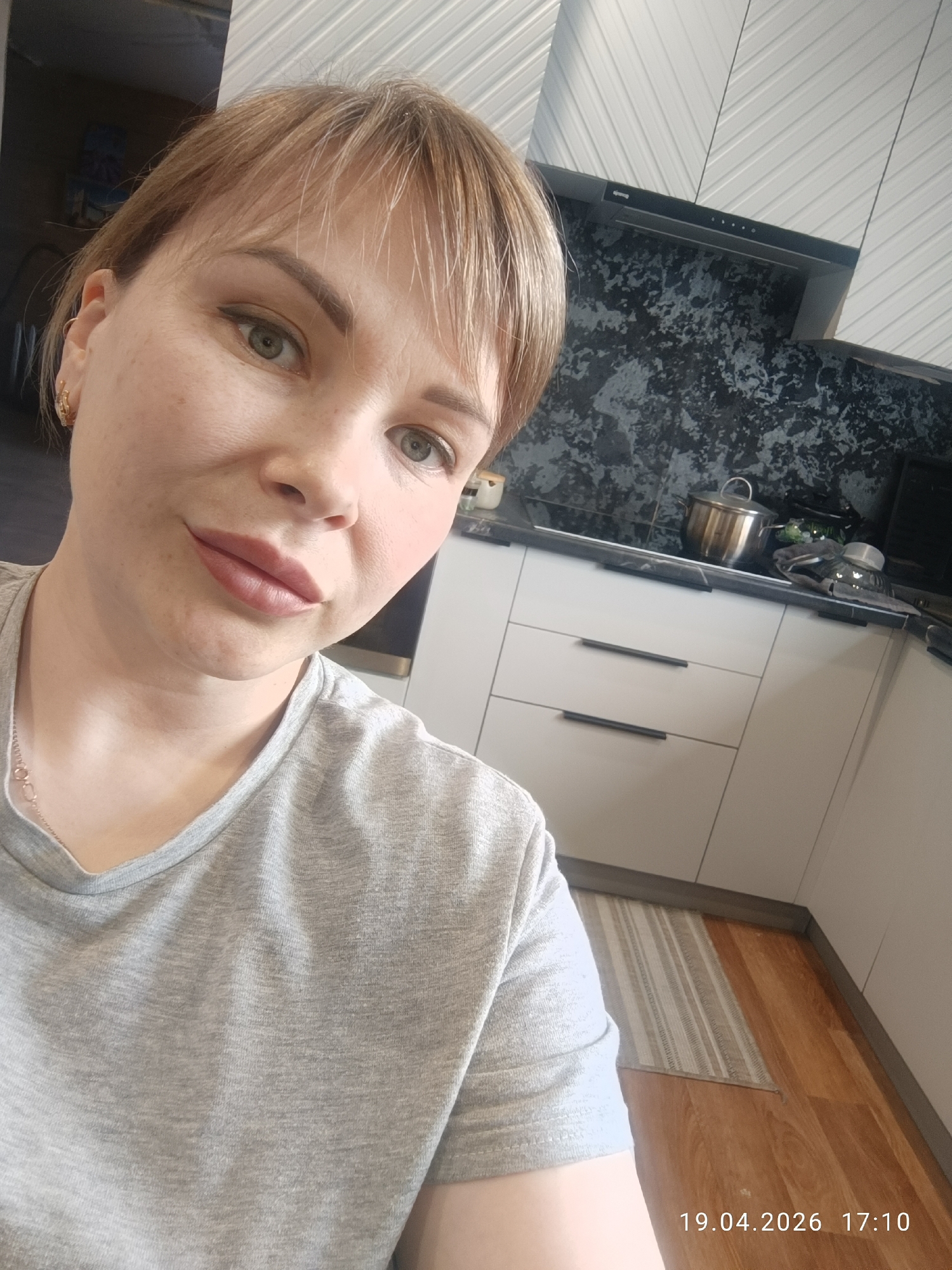 Woman takes kitchen selfie in Chaikovsky, Russia