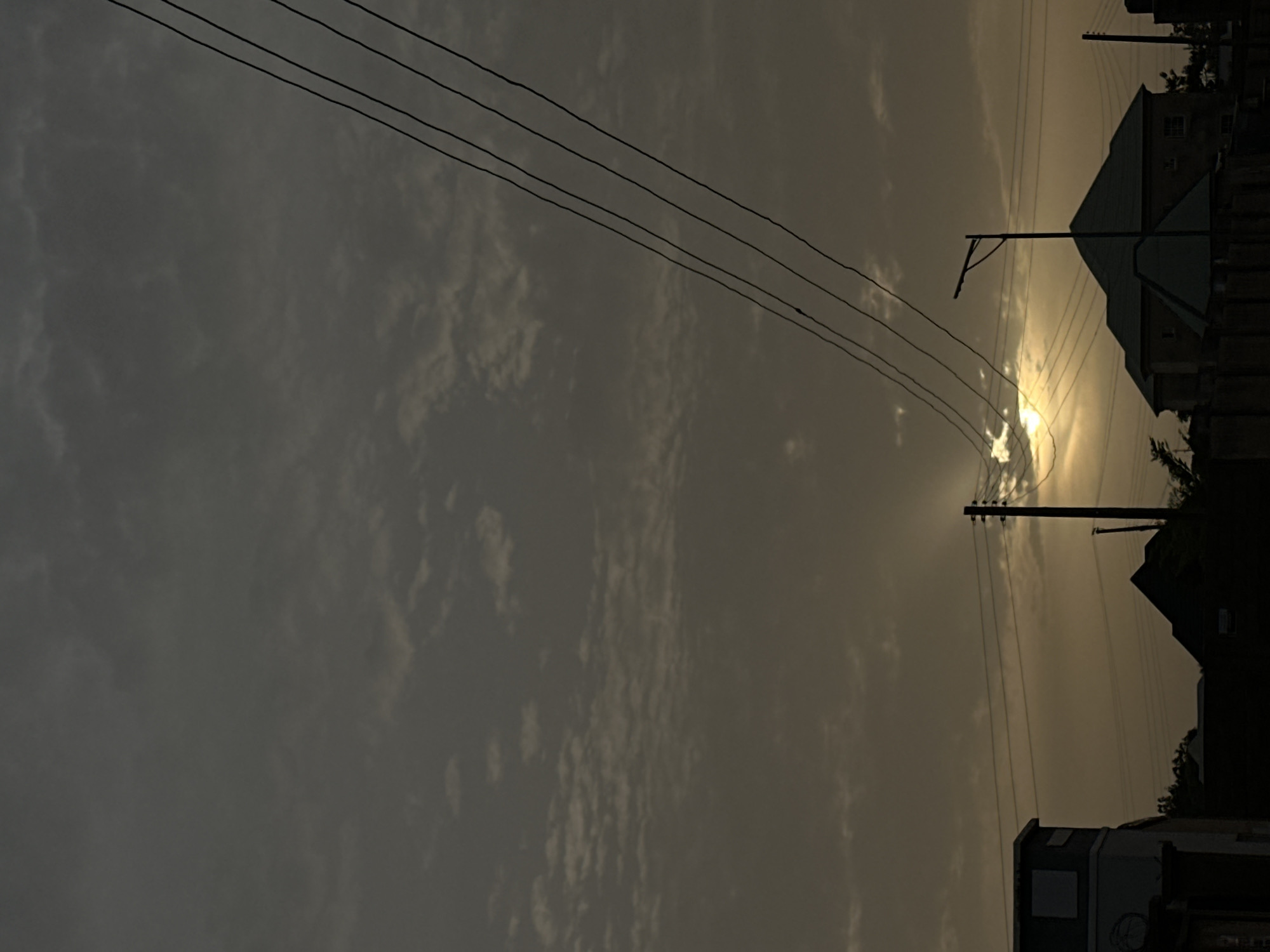 Overcast skies with power lines documented in Kirana, Nigeria