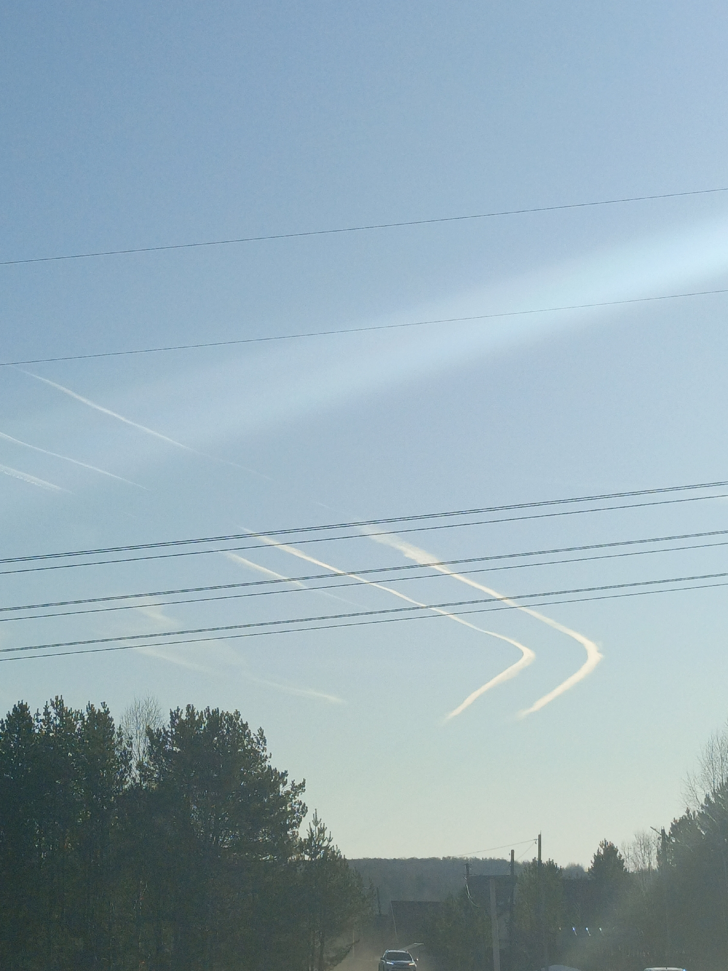 Aircraft contrails form V-patterns over Dubovaya, Russia