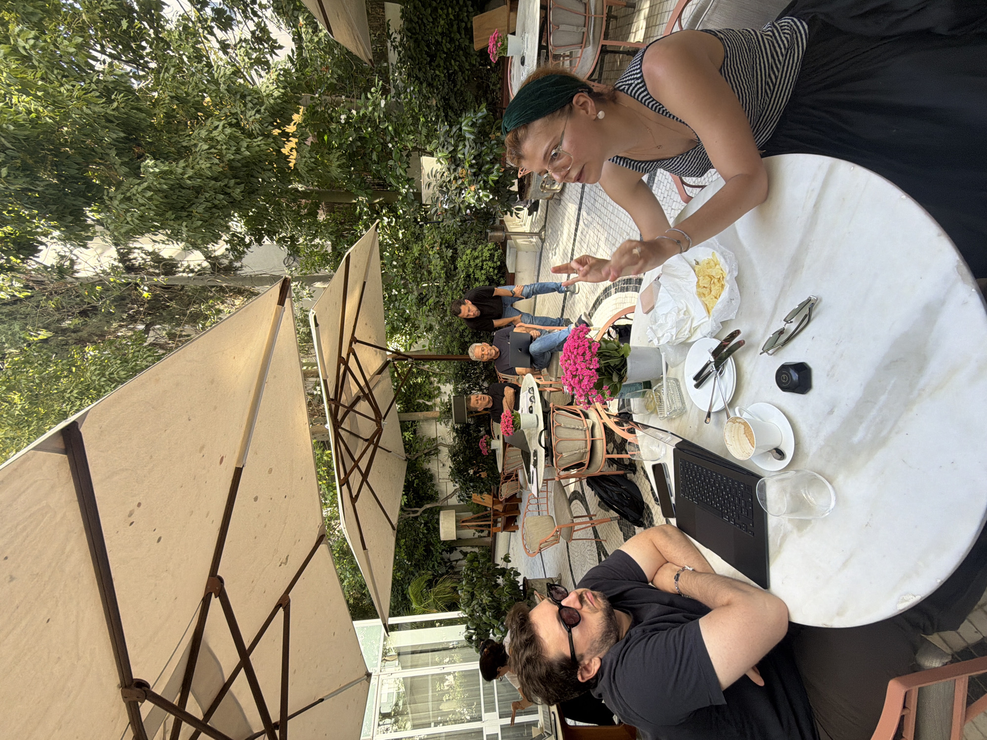 Afternoon cafe time in Tel Aviv with blooming trees