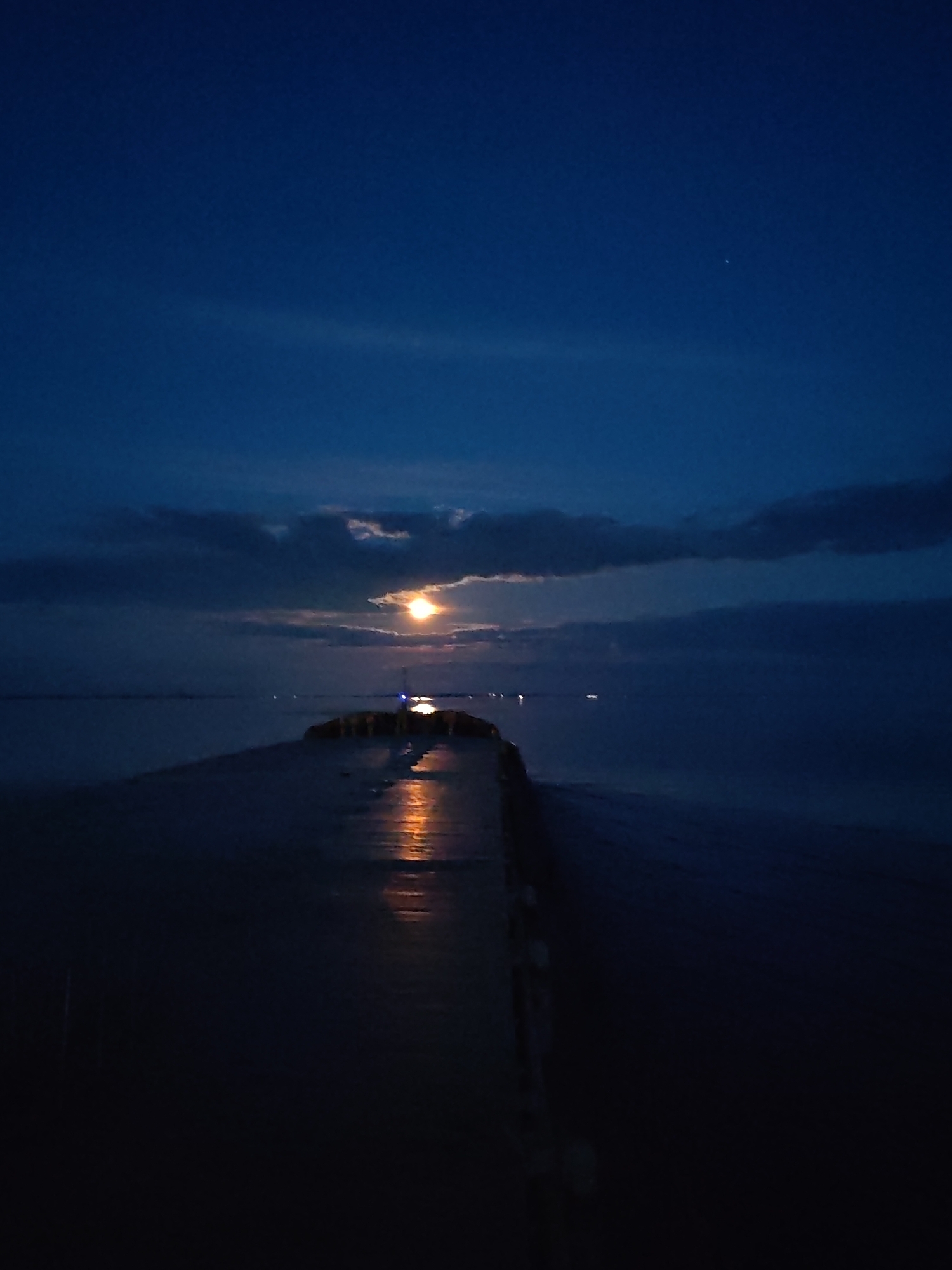 Full moon illuminates waterscape in Bol'shie Mkhi, Russia