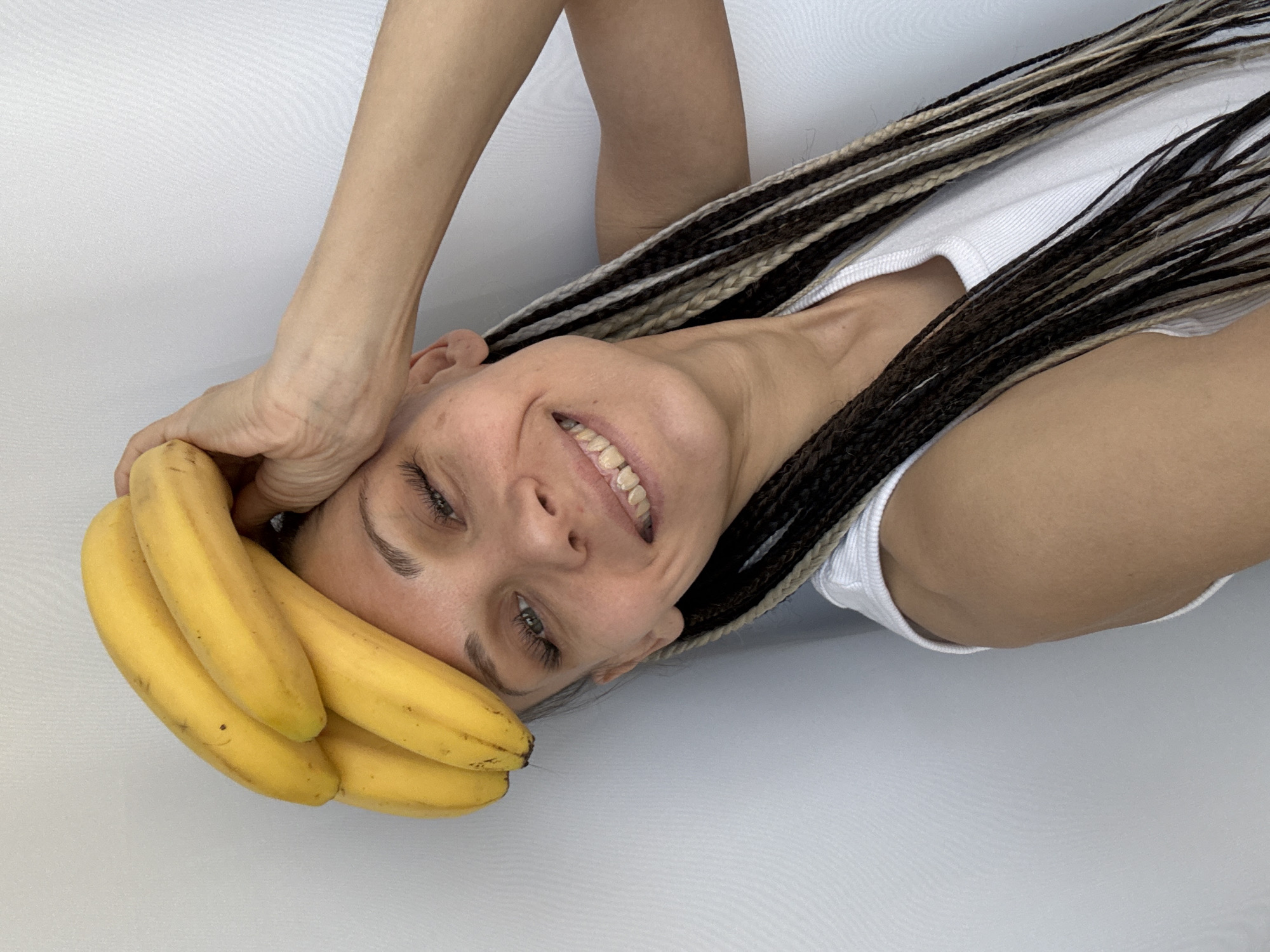 Woman photographed with bananas in playful pose in Rusanovo