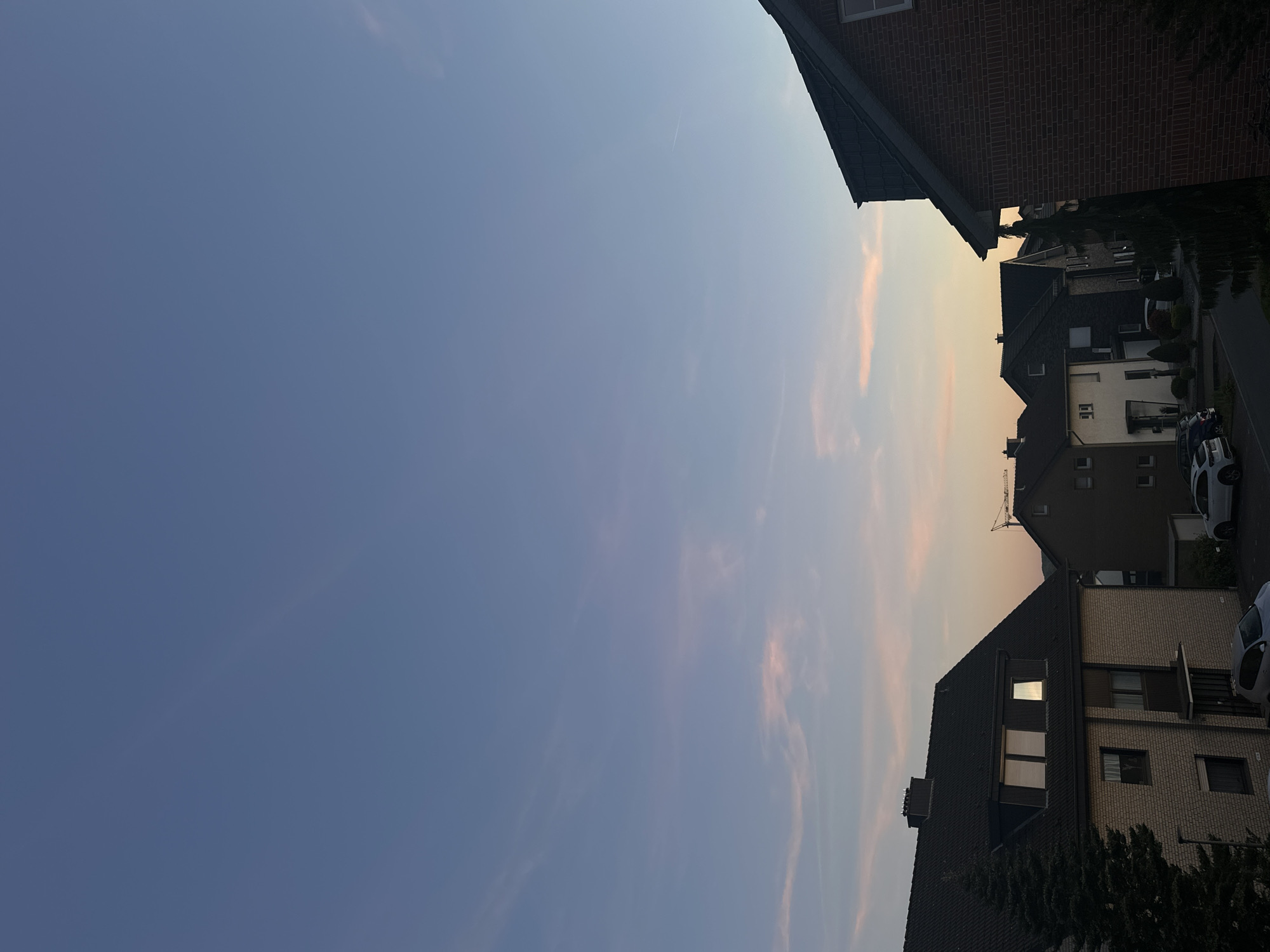 Dramatic sky captured over residential Melle street at sunset