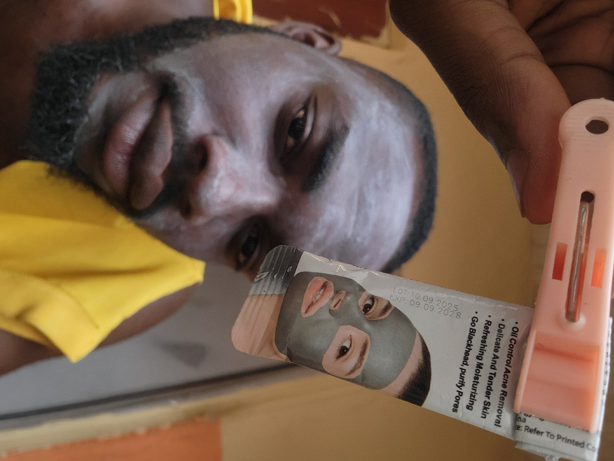 Man applies face mask in Jos, Nigeria