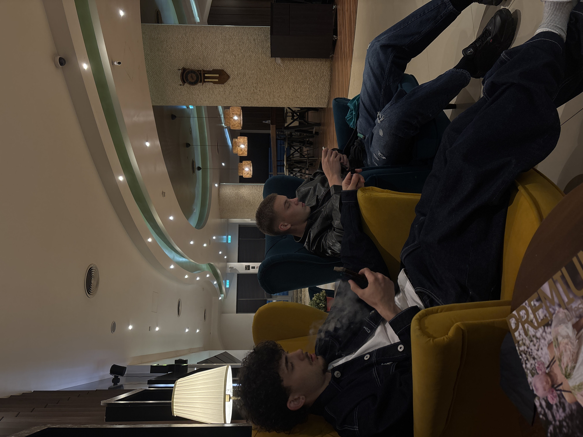 Young men relax in Sofia lounge area evening