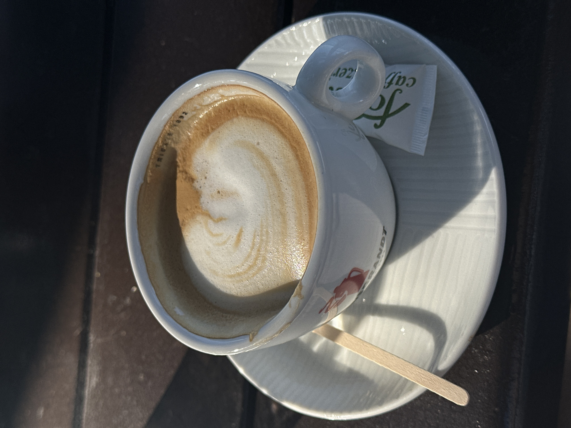 Cappuccino with latte art on a wooden table in Montenegro