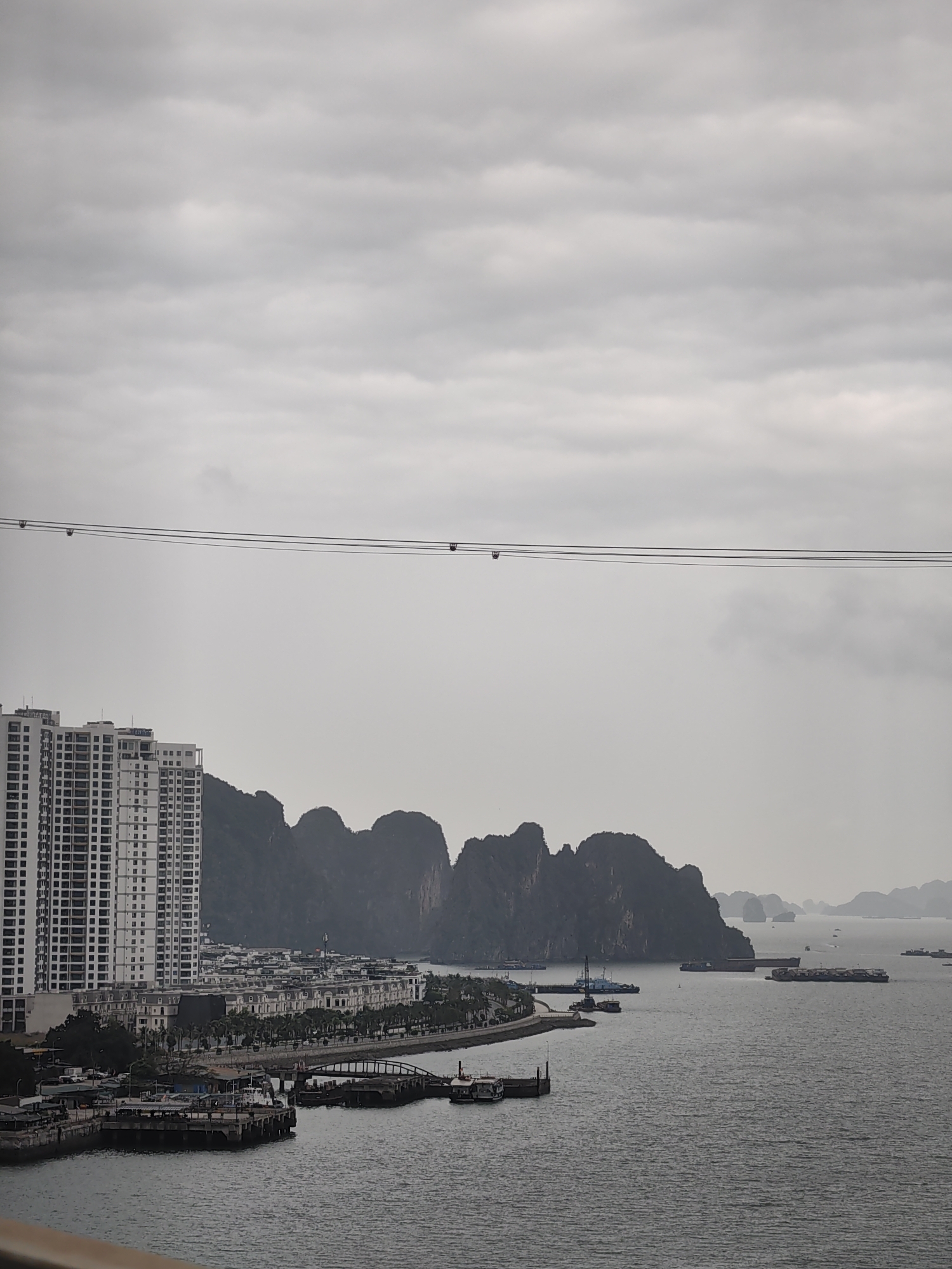 Overcast morning view captures Ha Long Bay coastal development