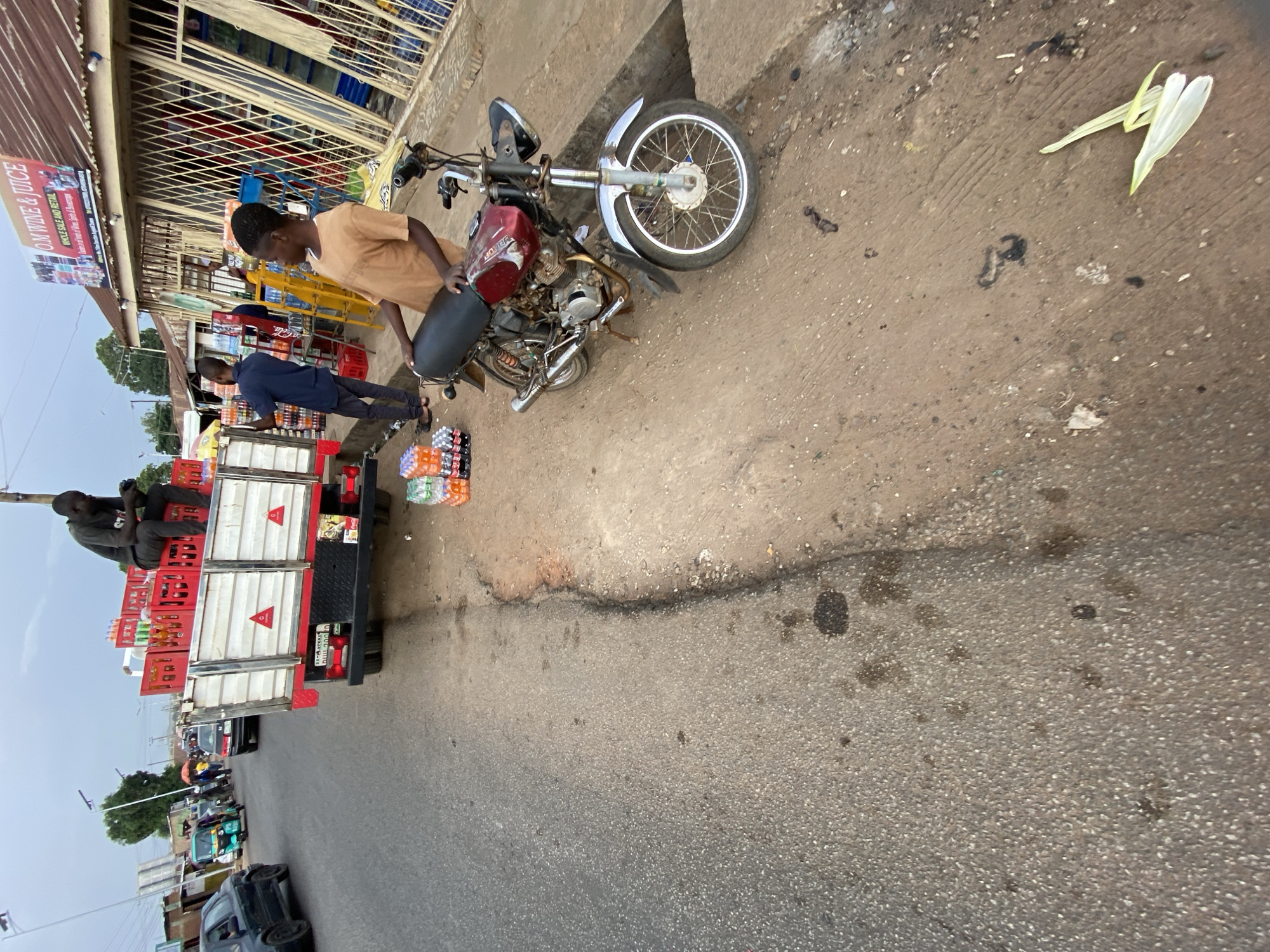 Roadside market activity documented in Jos, Nigeria commercial district