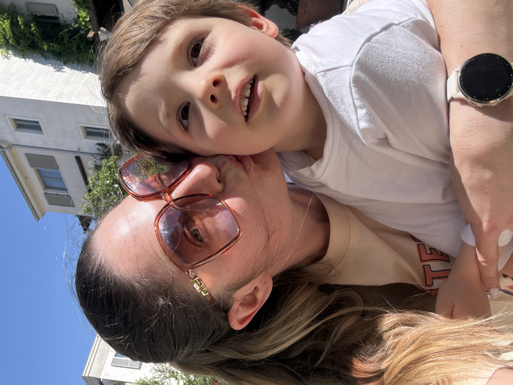 Adult and child share tender moment in Tivat