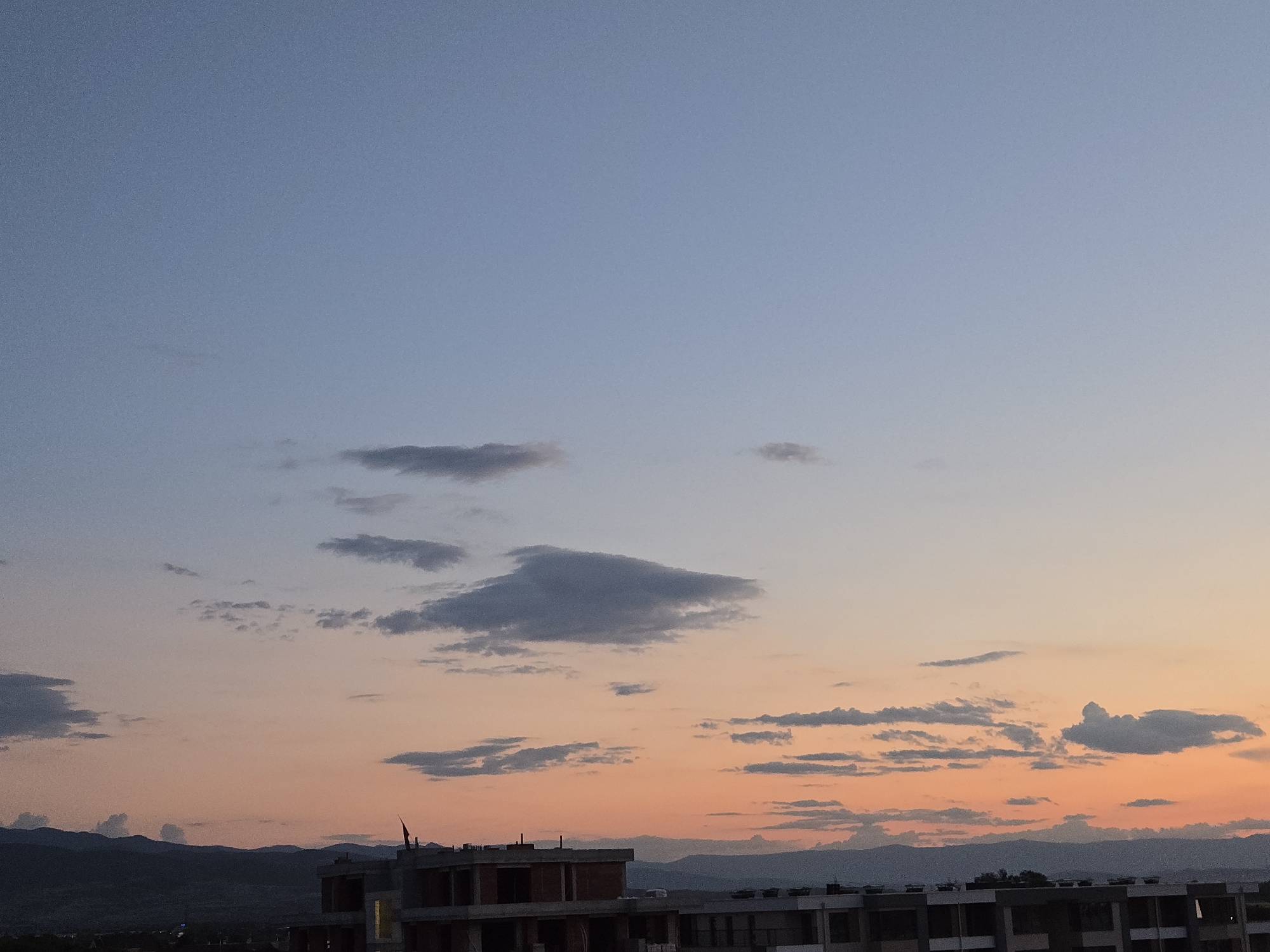 Evening construction scene with children's bikes observed during sunset
