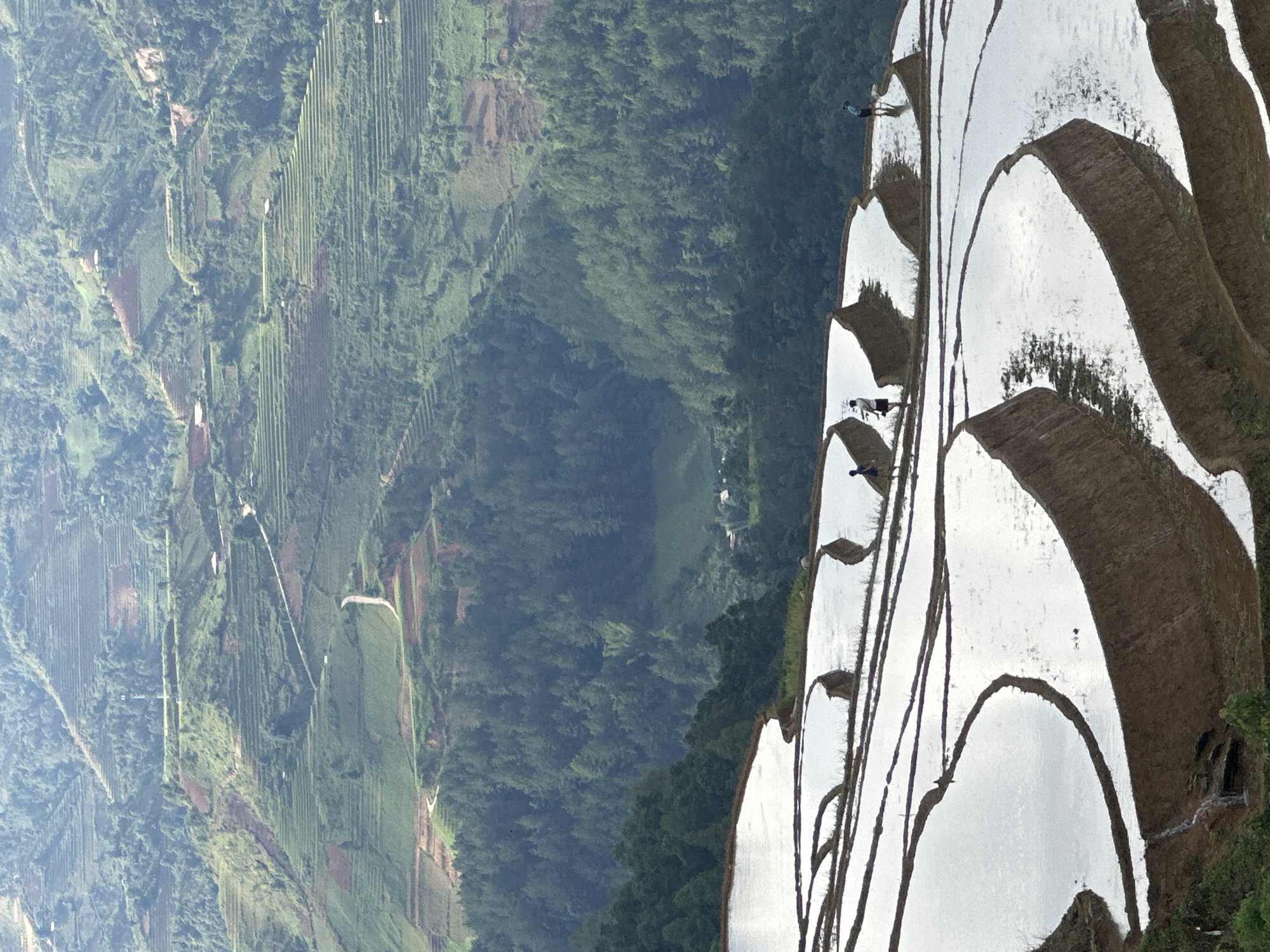 Motorcyclist documents terraced rice fields in Lao Chai, Vietnam