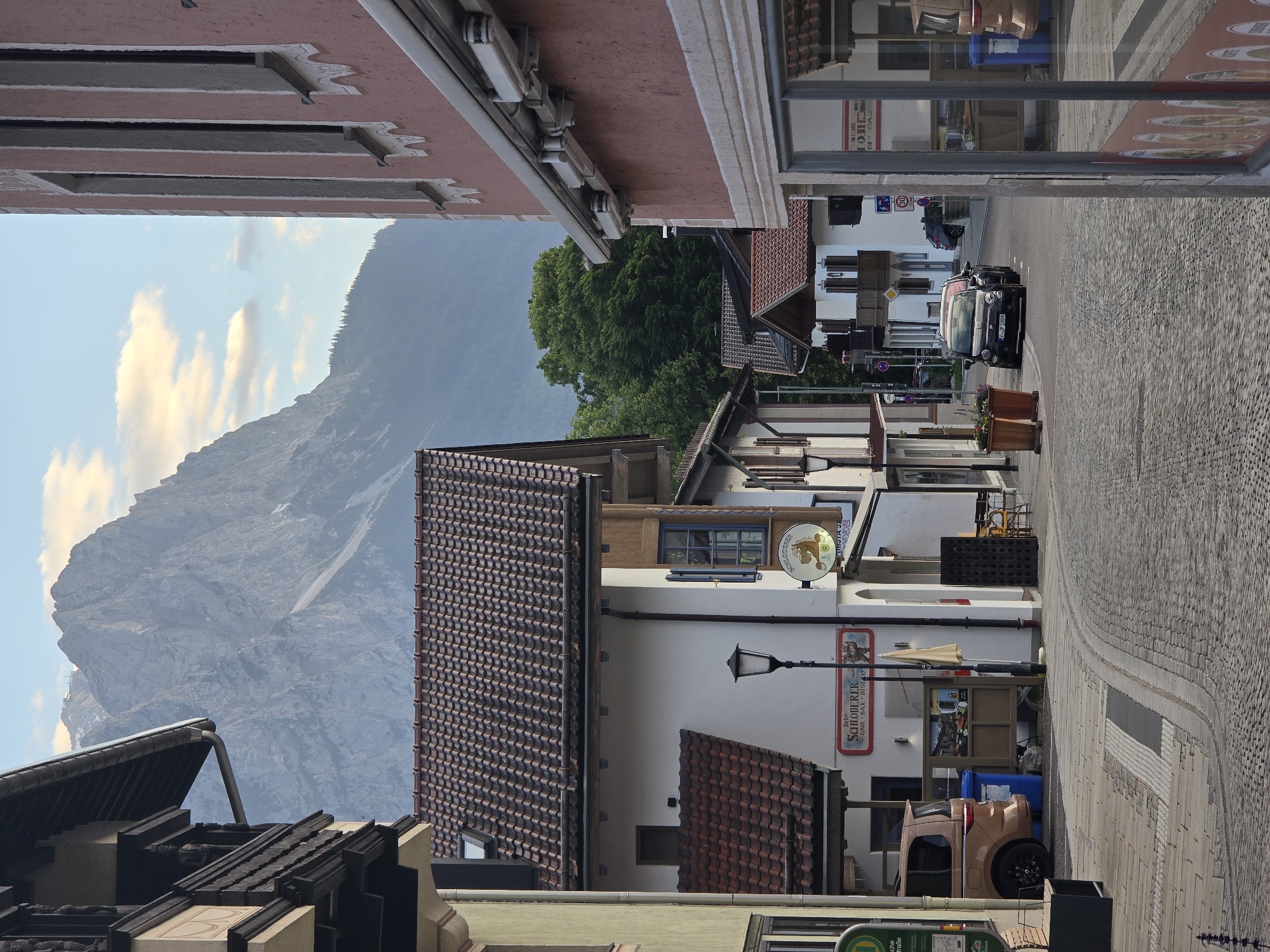 Golden hour in Garmisch-Partenkirchen, Alps looming over Bavarian streets