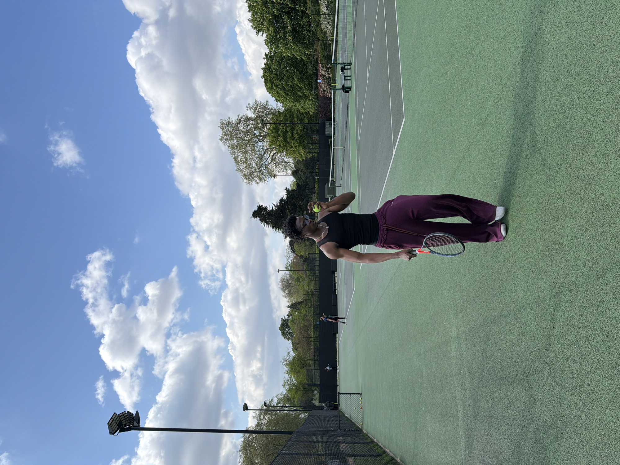 Tennis match in progress at London outdoor court