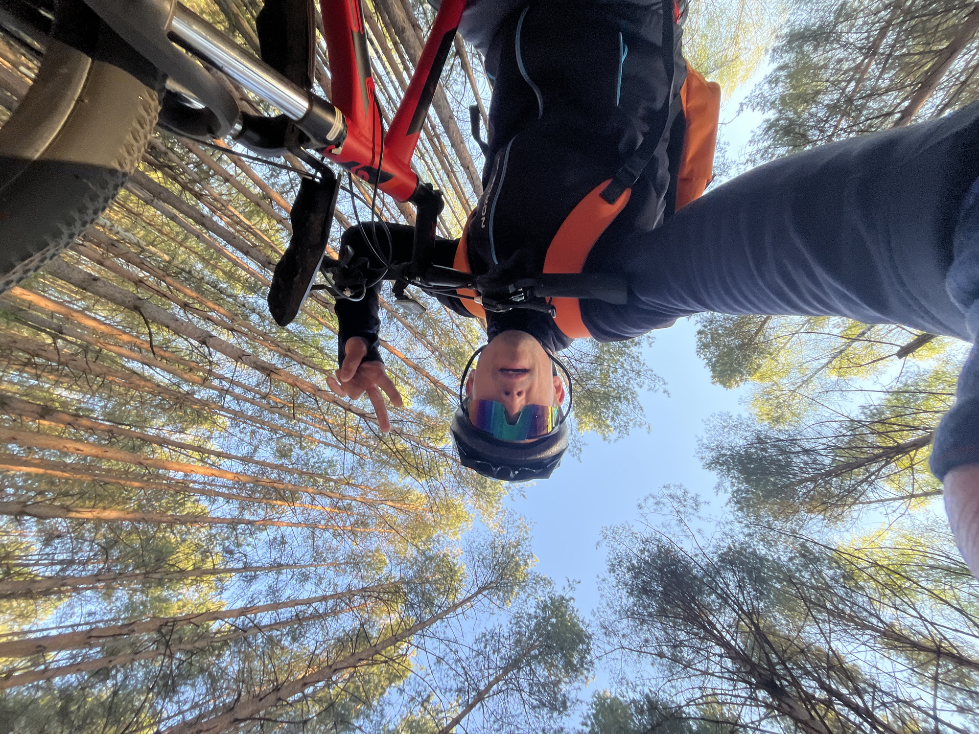Cyclist poses upside down with mountain bike in Chaikovsky