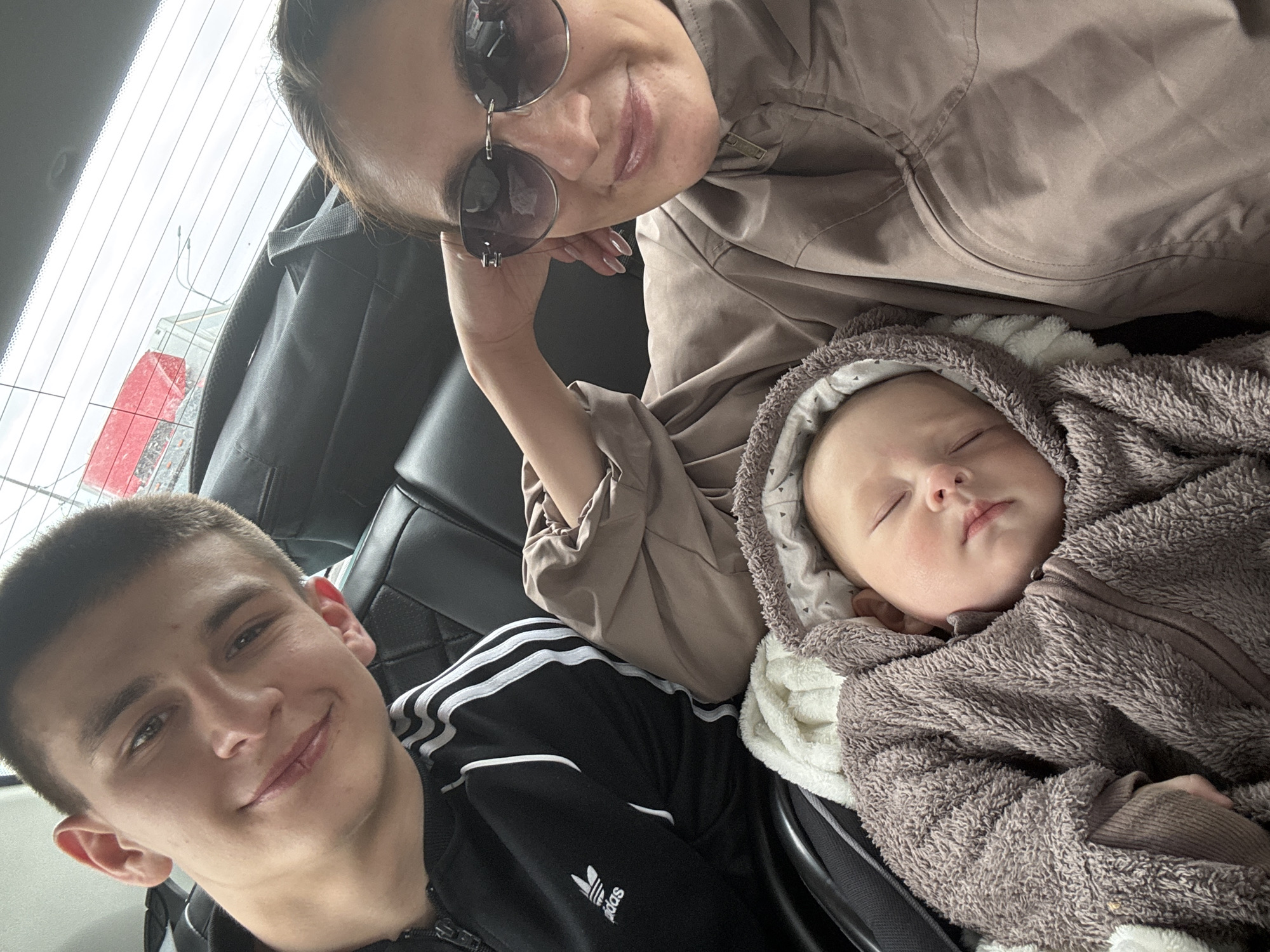 Family with baby photographed during car journey in Sochi