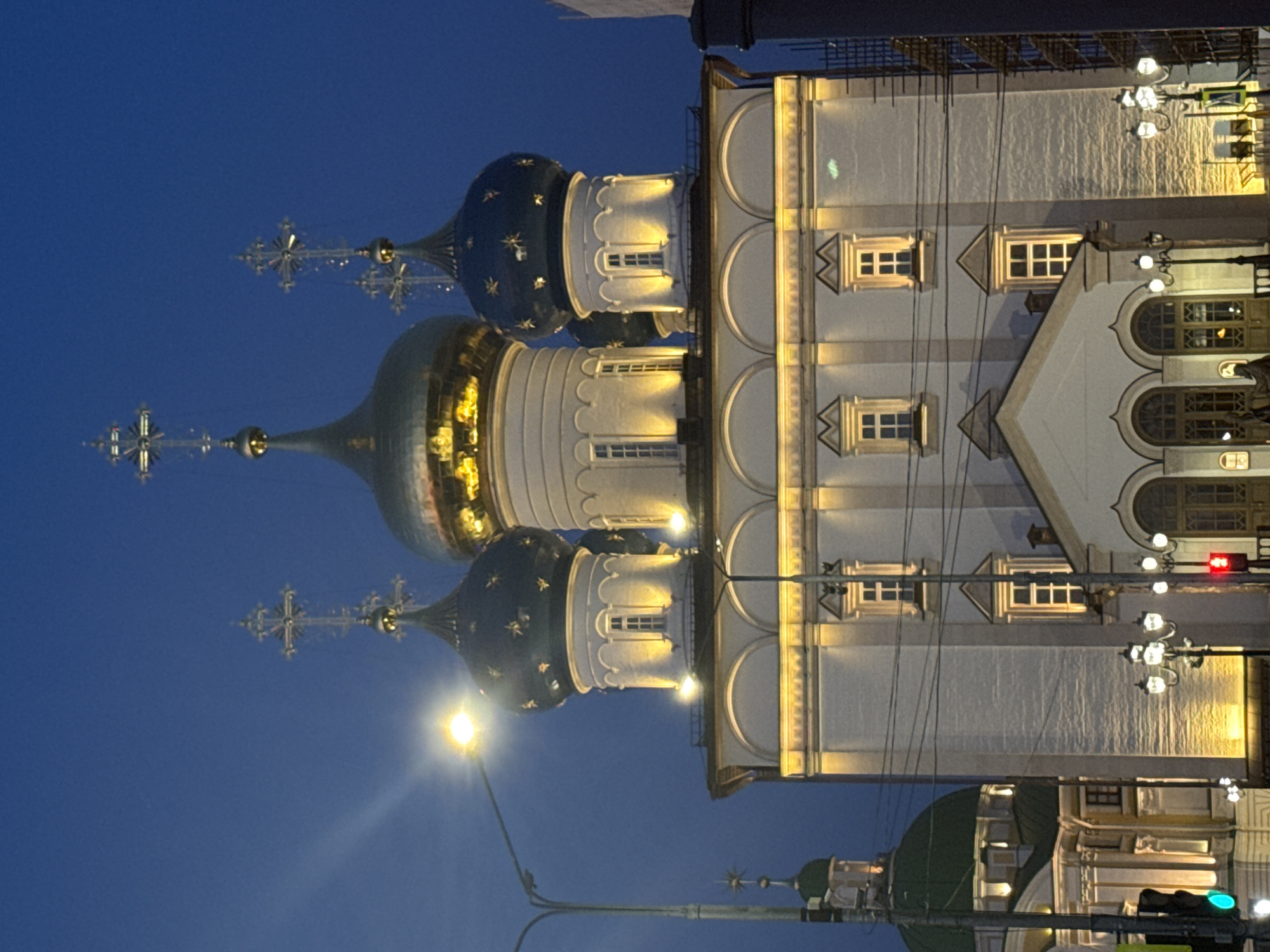 Orthodox church domes illuminated at night in Tver, Russia
