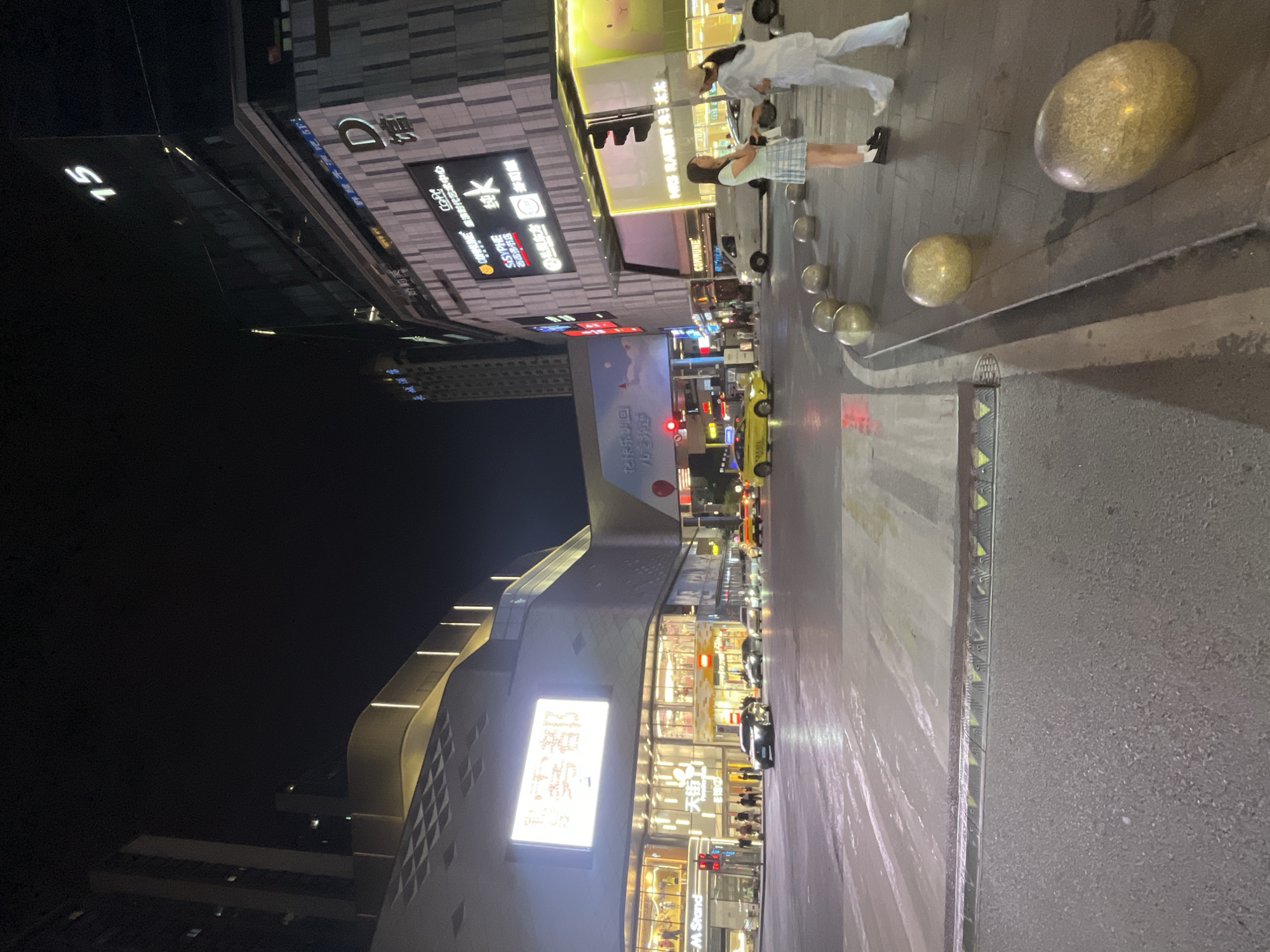 Nighttime commercial district scenes captured in Yuzhong District