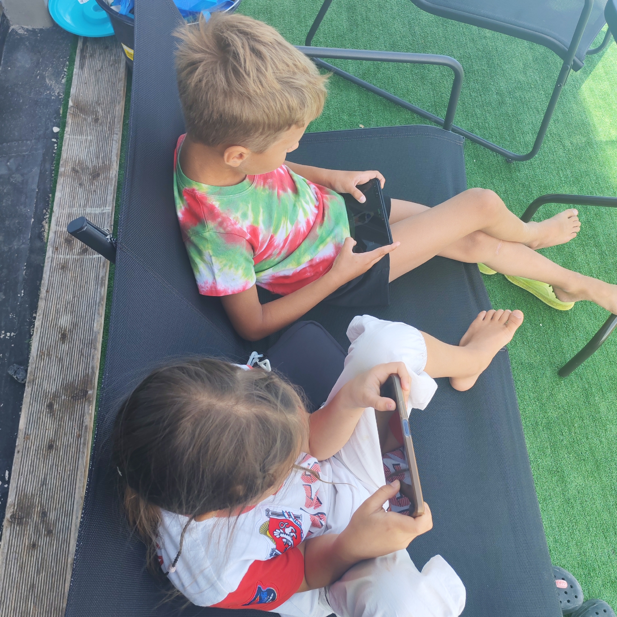 Backyard pool day with kids on a sunny July morning
