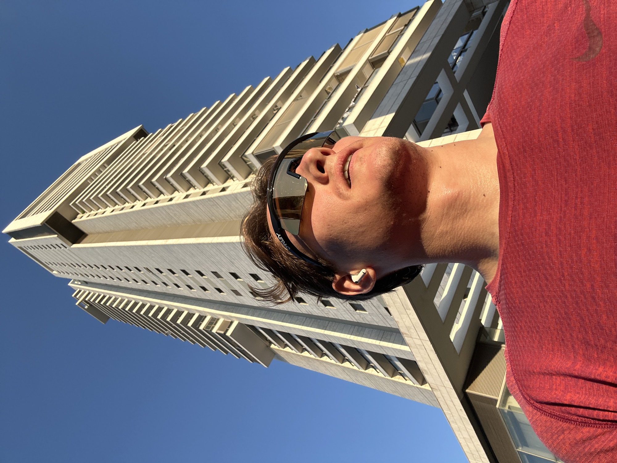 Man gazes up at building in Ramat Gan
