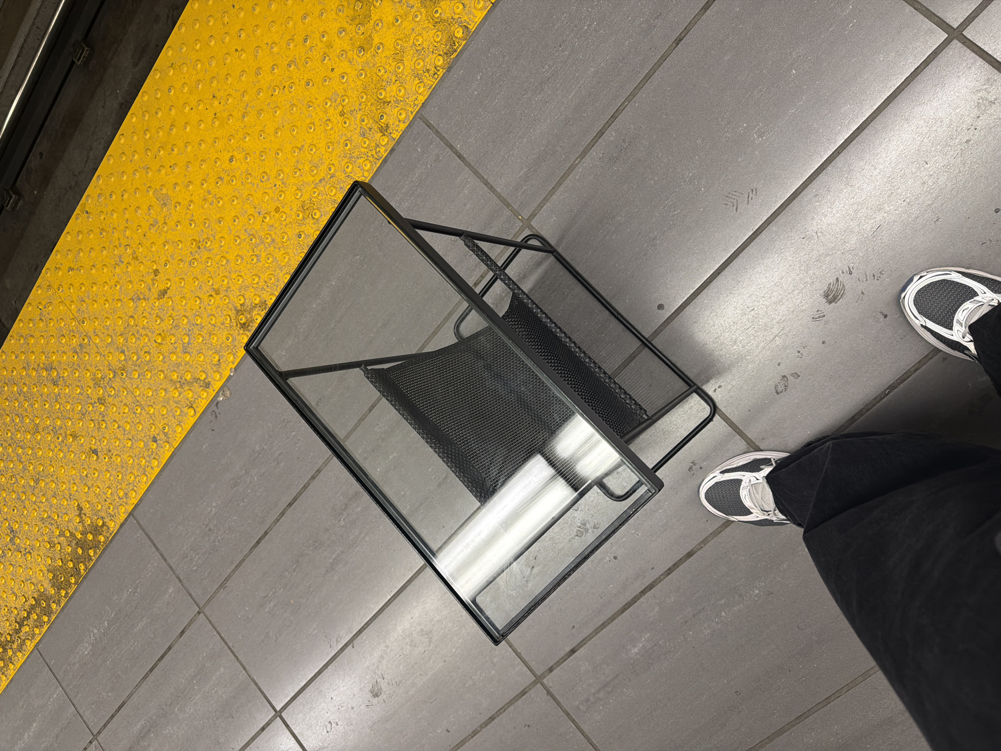 Magazine rack found on tactile paving strip in Montreal