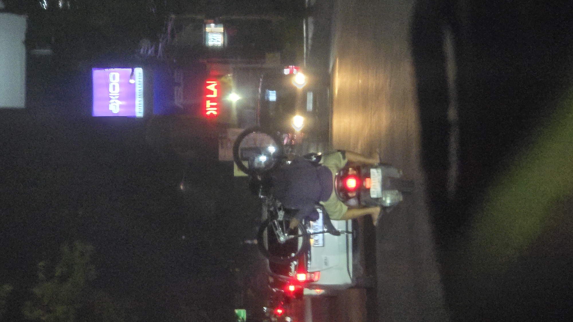 Motorcycle rider spotted on Batubulan street at night