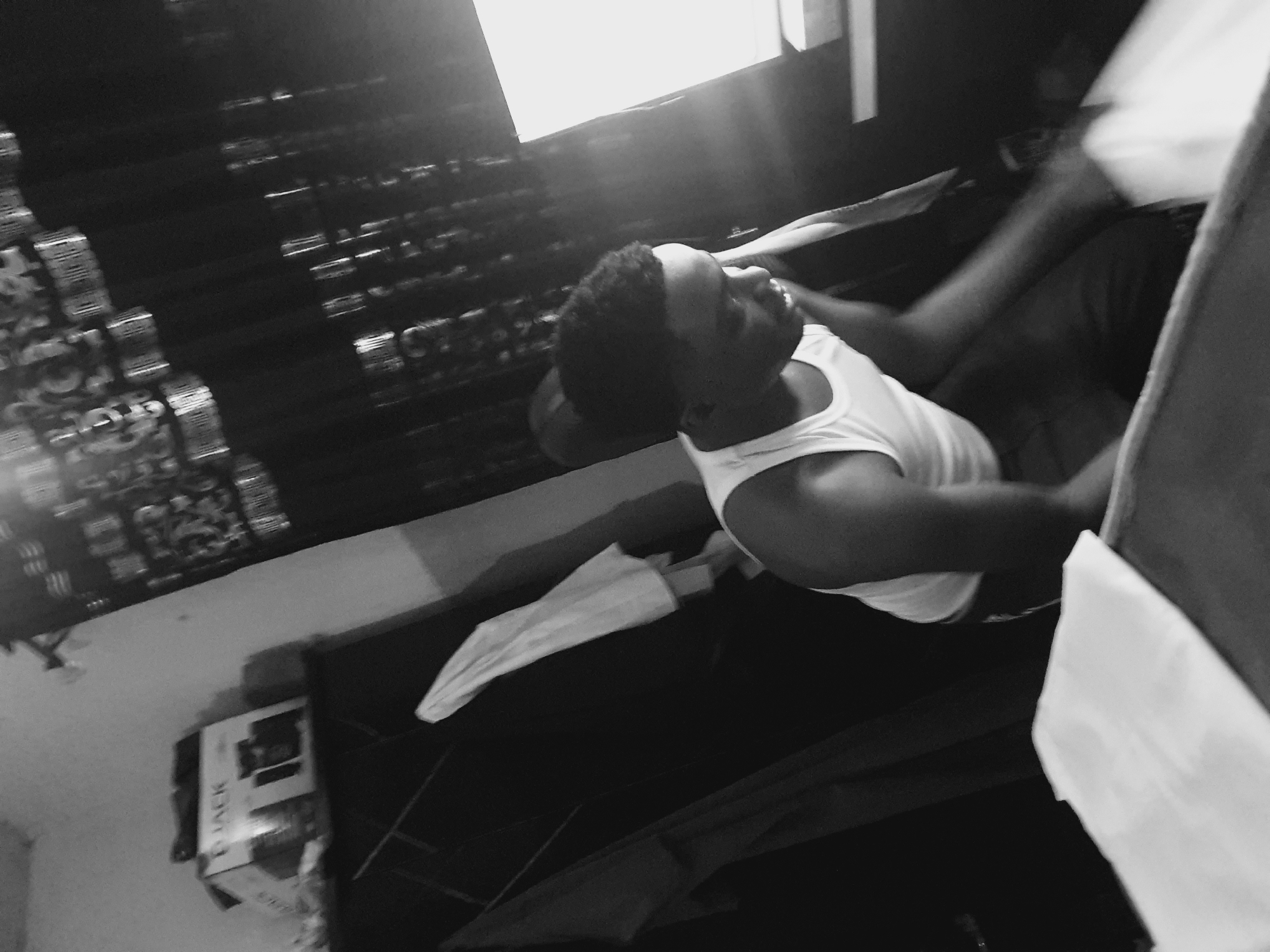 Man documented in various poses inside Lokoja room