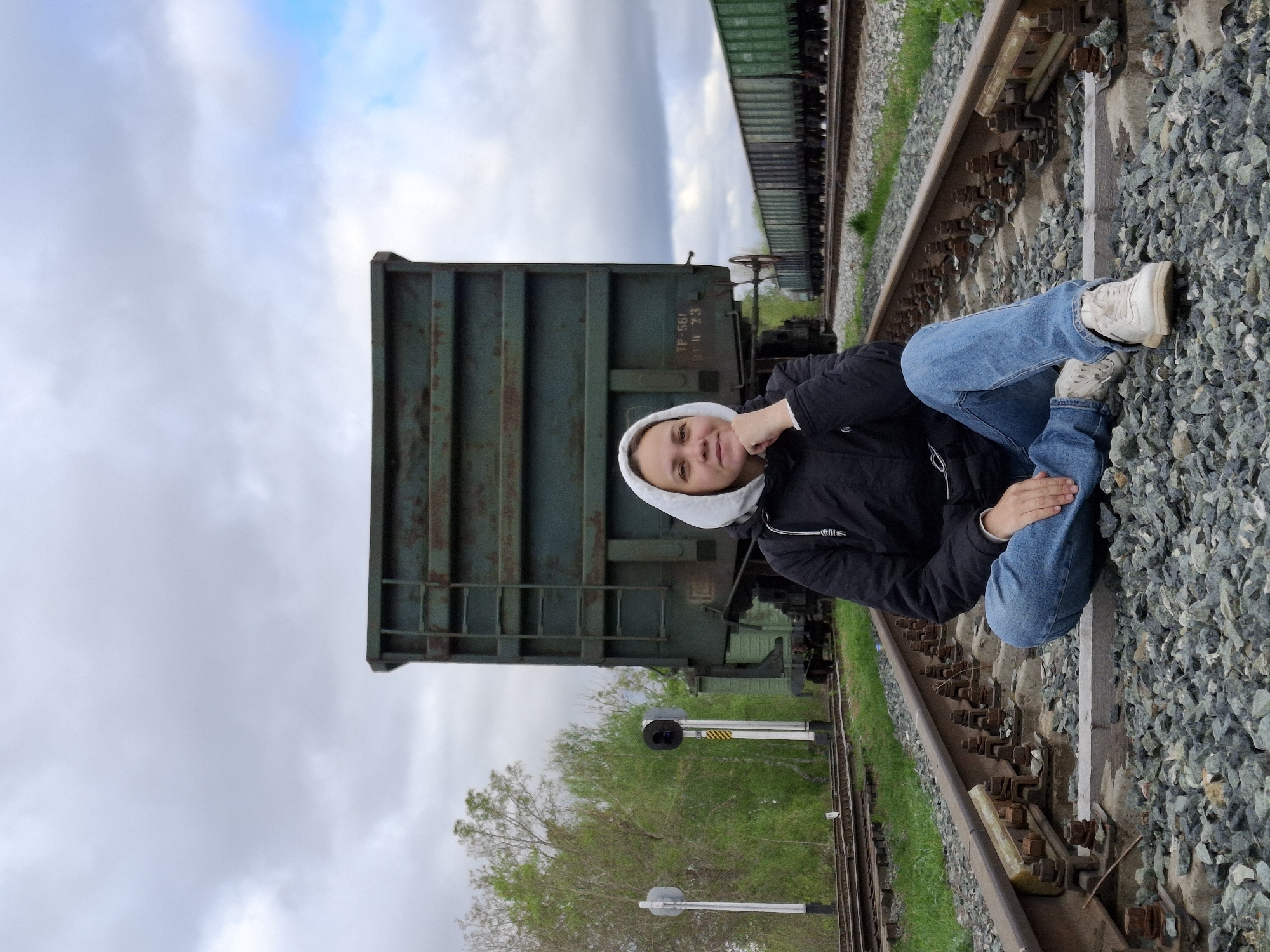 Person walks railroad tracks in Chaikovsky Russia early morning