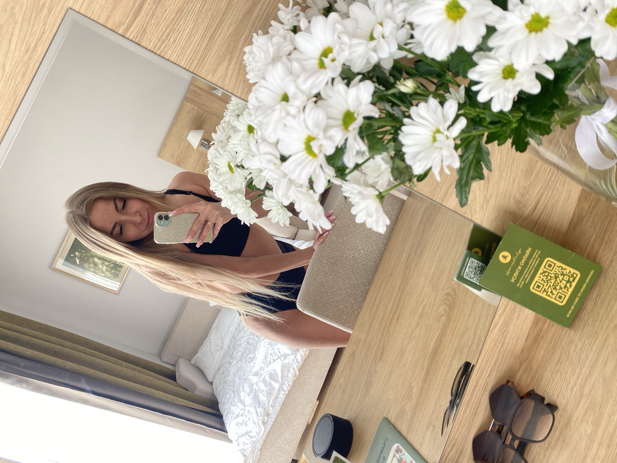 Woman takes mirror selfie in Tyumen apartment