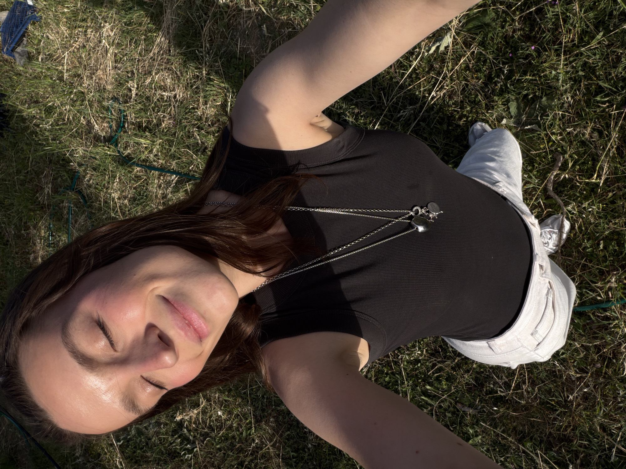Woman rests while man plants flowers in Montenegro field