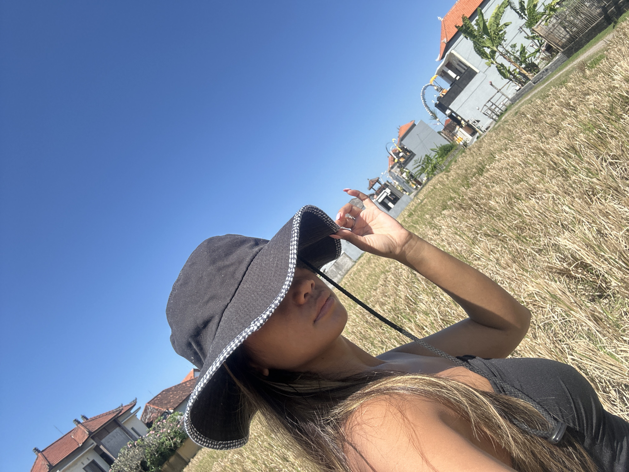 Hat selfies and a cat in Sukawati's golden rice fields