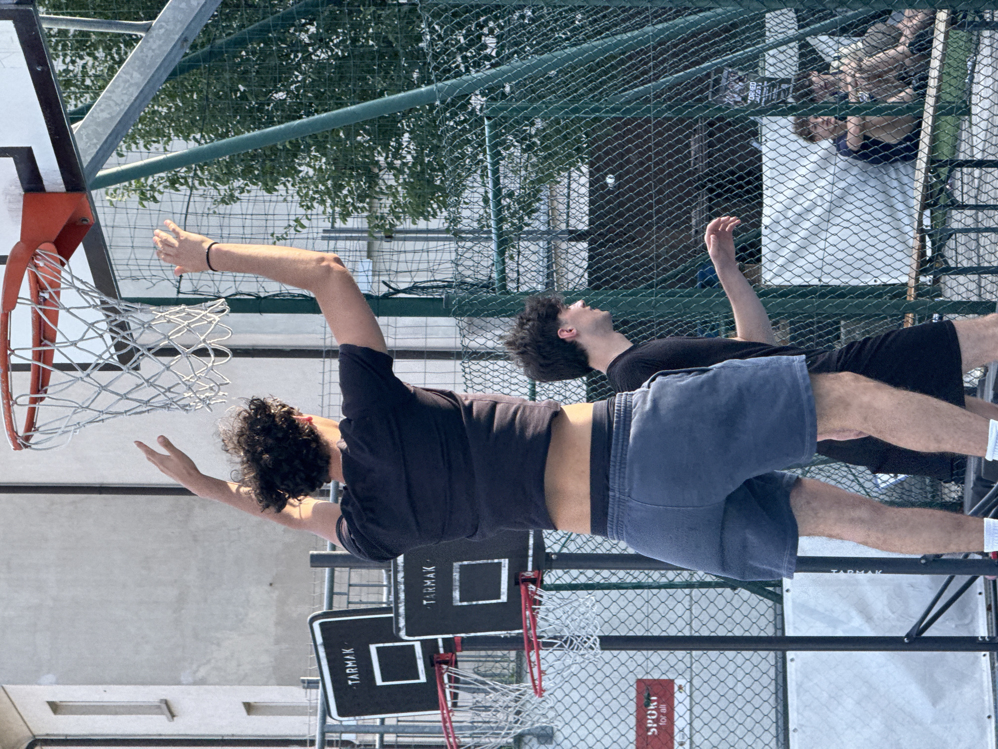 Outdoor basketball and foosball games documented in Milan