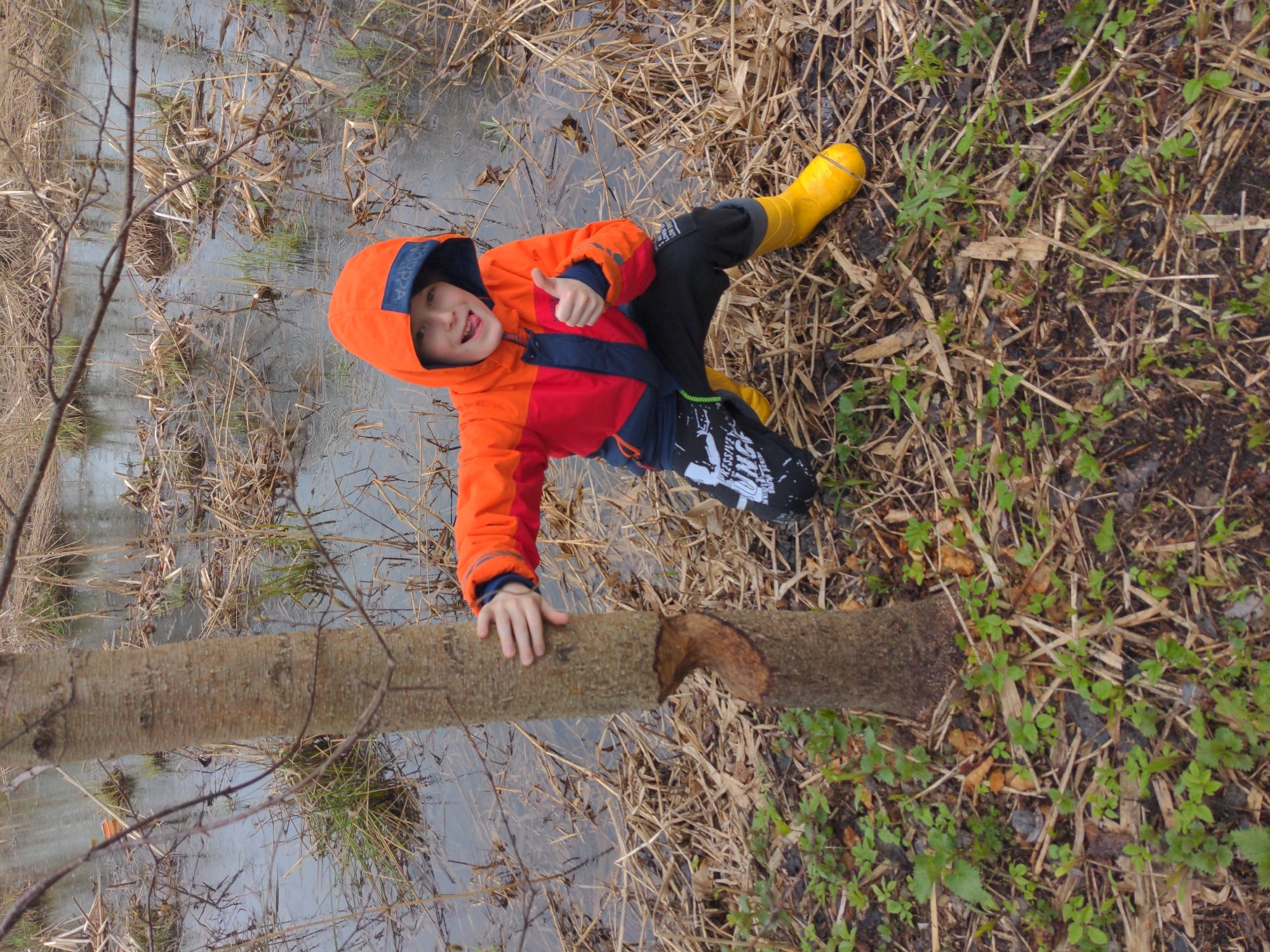 Child plays near stream in Khimki marshland