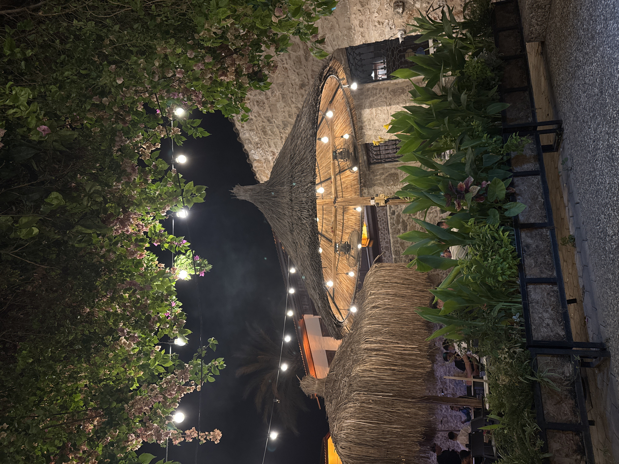 Antalya old city: nighttime dining spot and stone wall murals