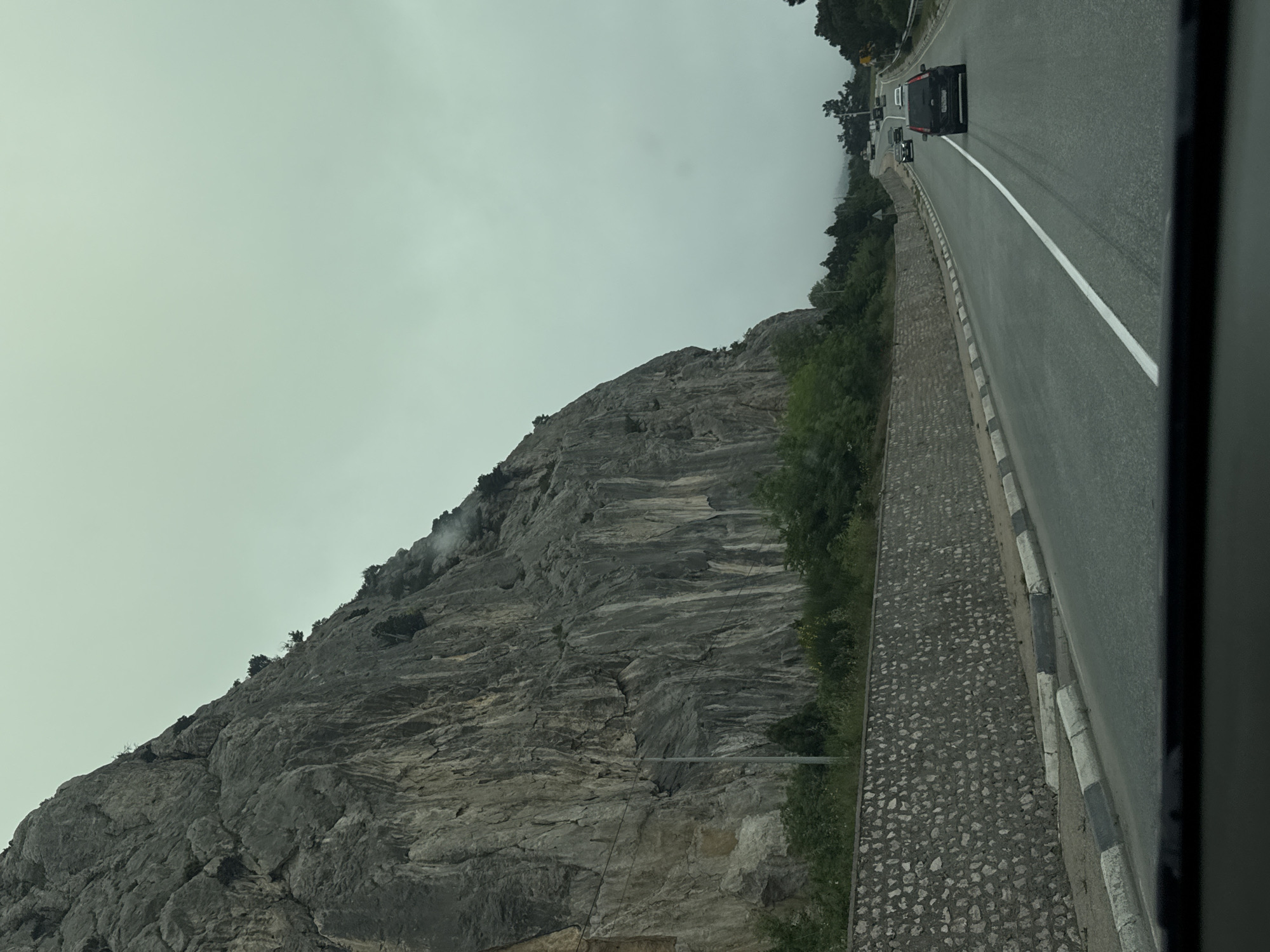Foggy mountain conditions documented by travelers during morning hours