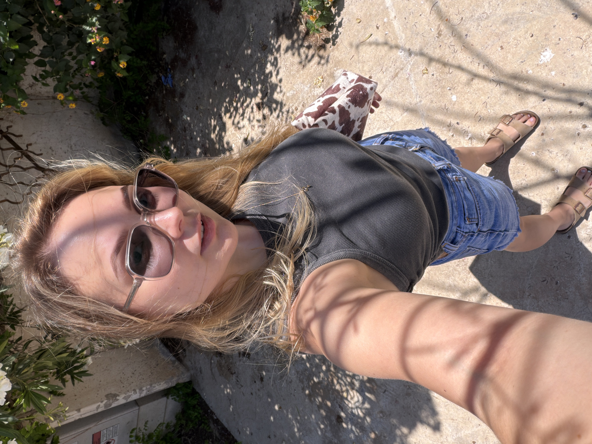 Woman takes sunny selfie in Tel Aviv
