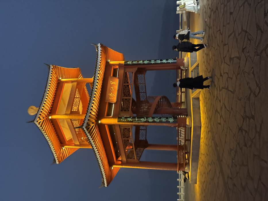 Group dancing and exercise activities at illuminated Jiangjin plaza