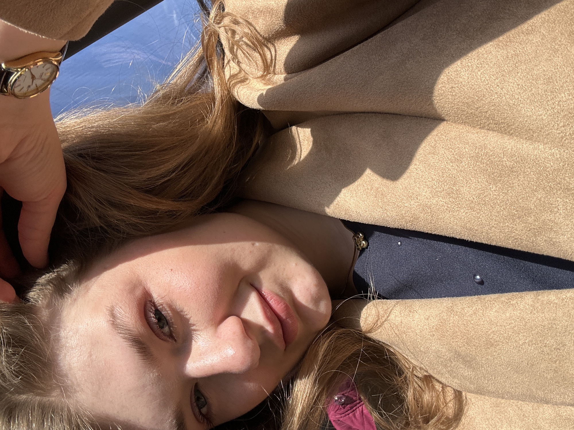 Woman takes selfie in Kazan wearing embellished blue outfit